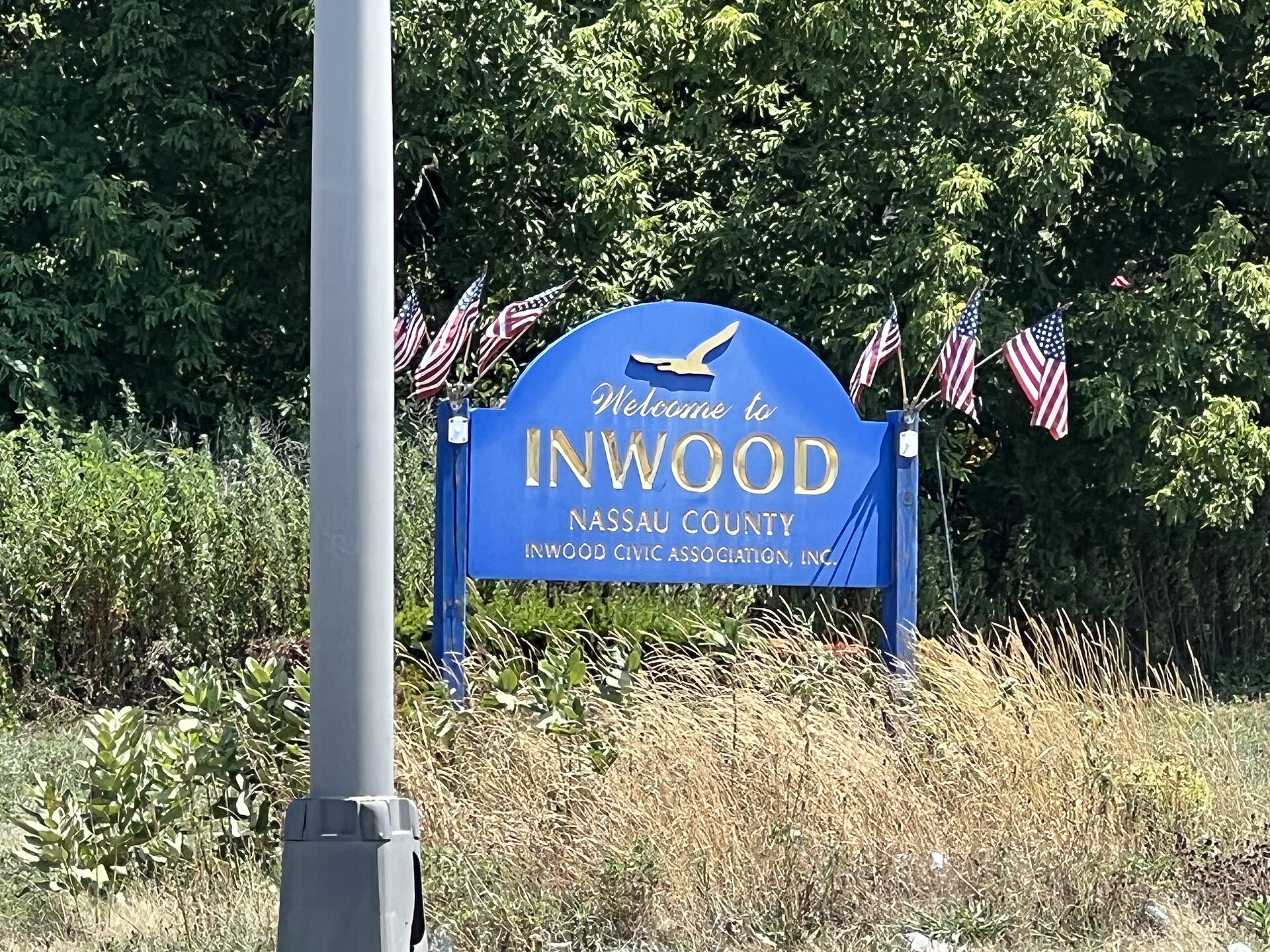 A welcome sign to Inwood, Nassau County, NY on August 8, 2022. This sign is located on the Nassau Expressway (NY 878), at its intersection with Bayview Avenue. — New York