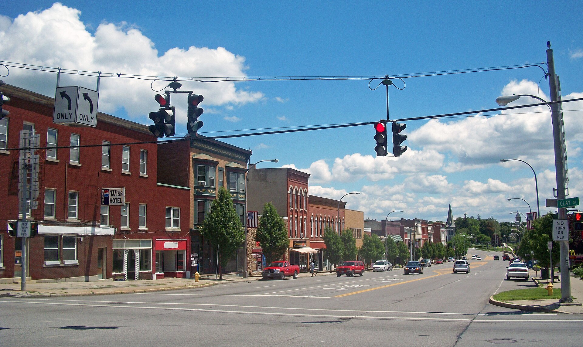 Commercial blocks of Main Street (NY 5) in Le Roy, NY, USA, looking east from junction with Clay and Lake streets (NY 19) — New York