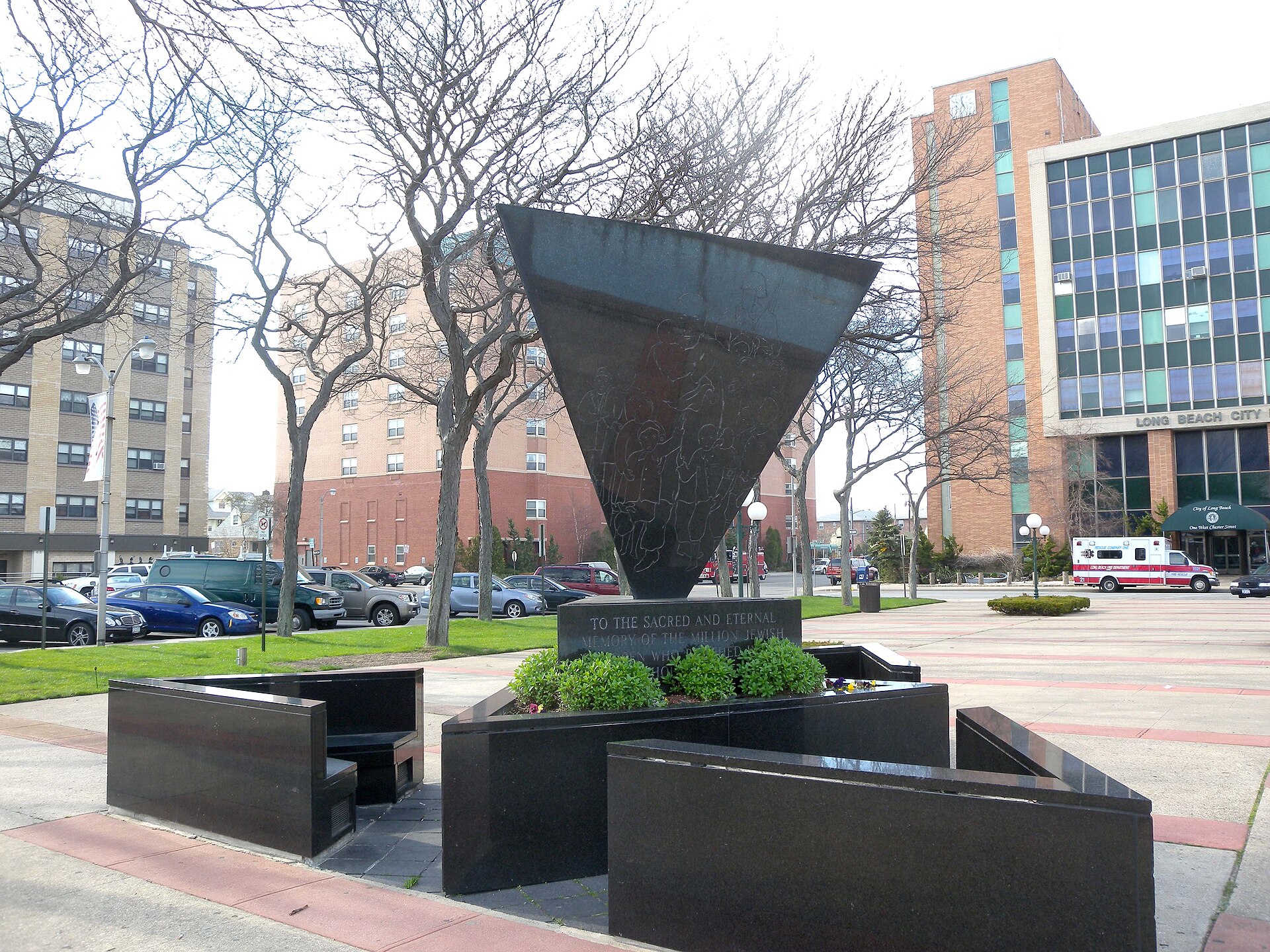 Looking northwest at Holocaust memorial in front of Long Beach City Hall on a partly sunny afternoon. — New York