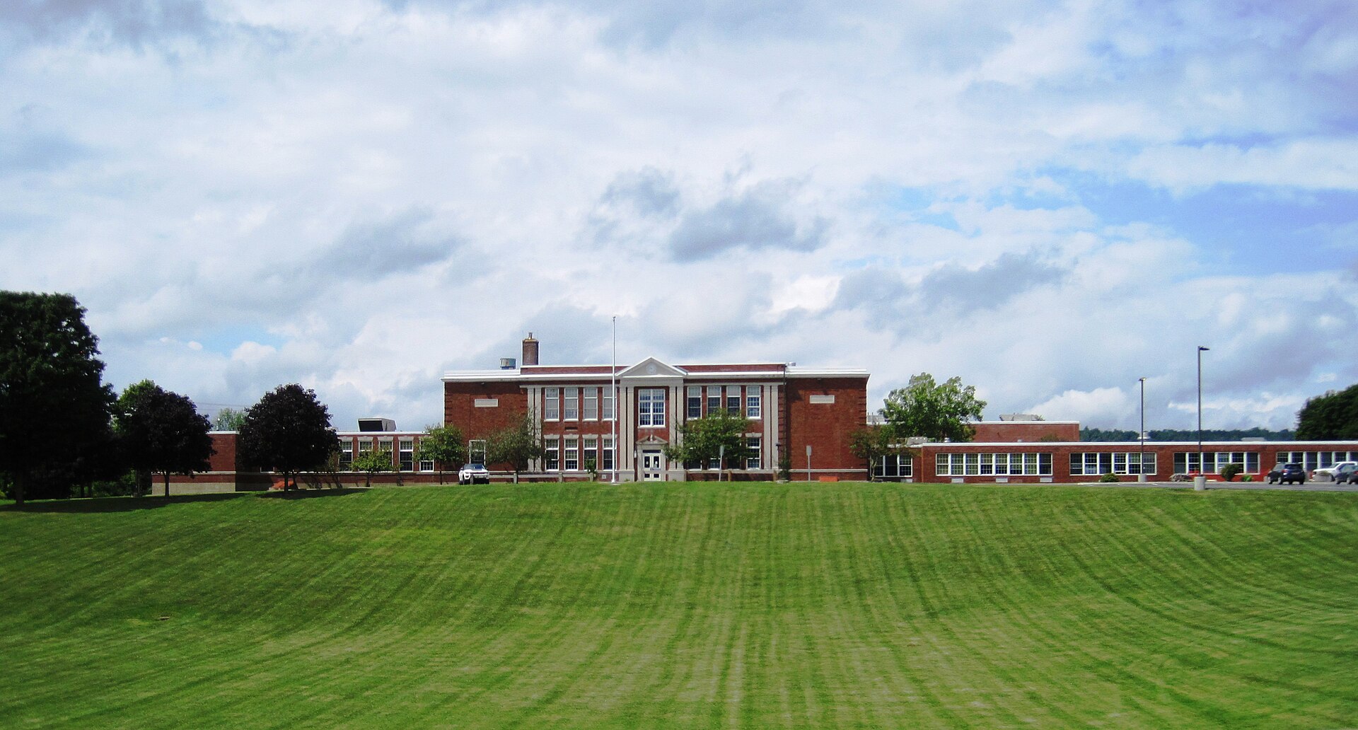 Photo of the Madison Central School in the village of Madison, New York. Photo taken looking north from U.S. Route 20 (Main Street).