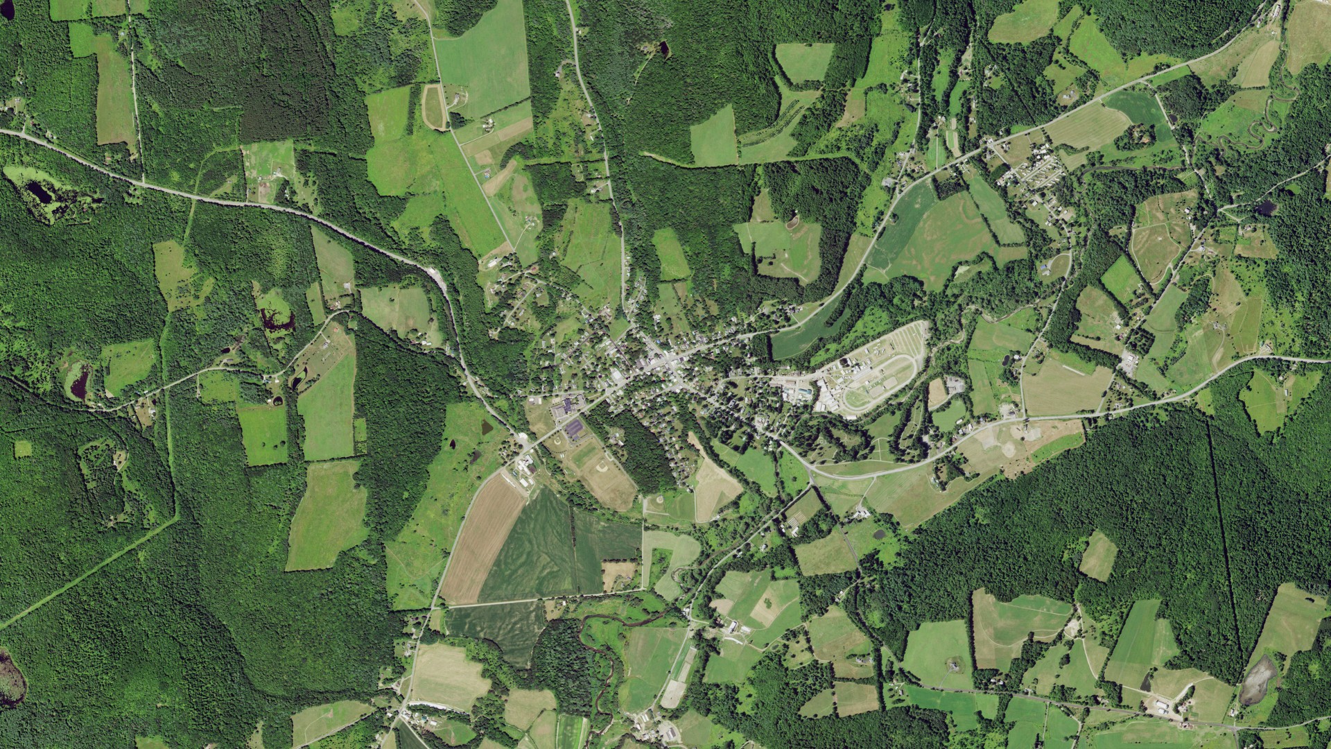 Natural-color aerial photograph of land around Morris, New York