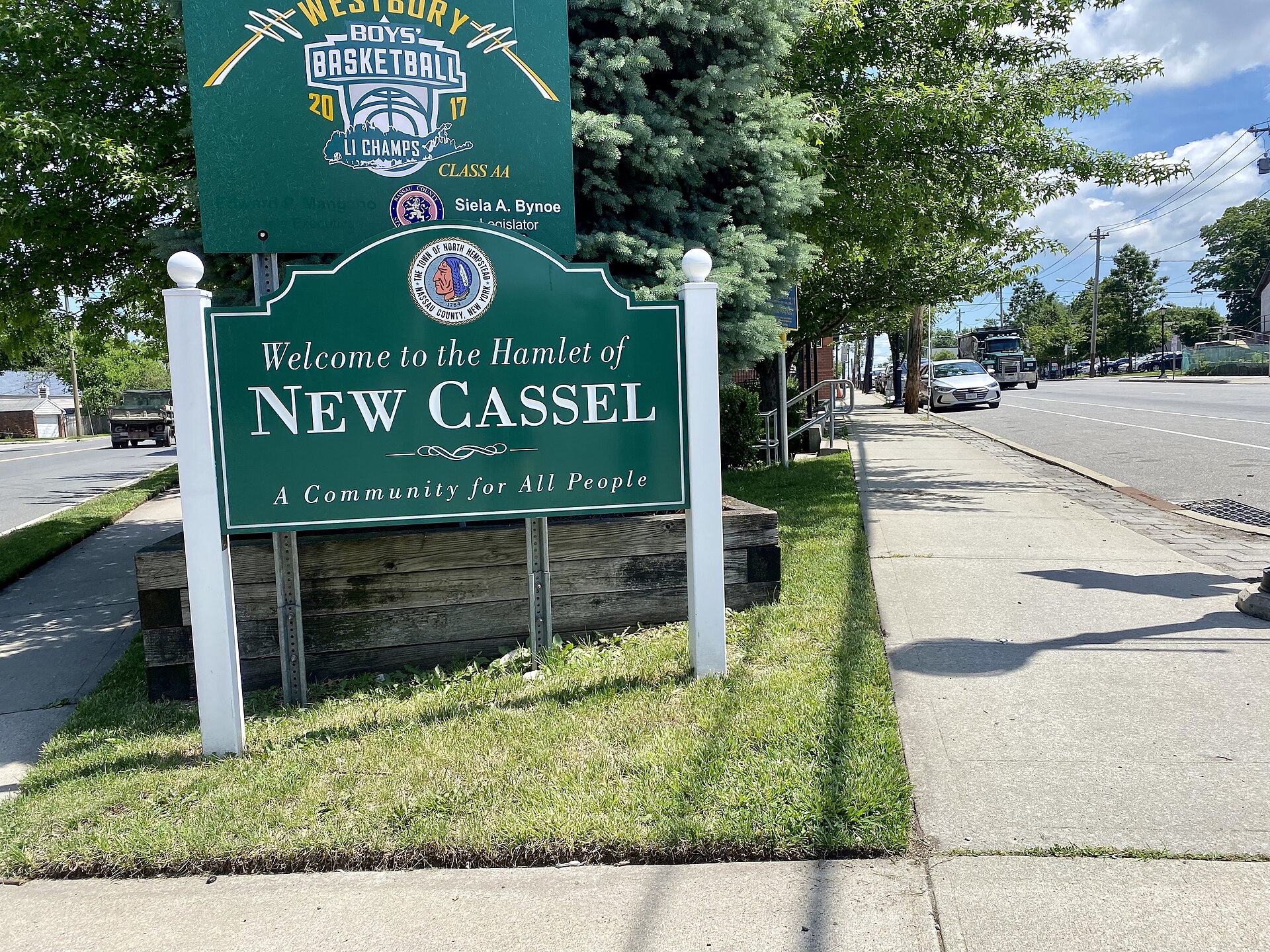 A gateway welcome sign at the entrance to the hamlet at the intersection of Union and Prospect Avenues. This photo was taken on June 9, 2021. — New Cassel, New York