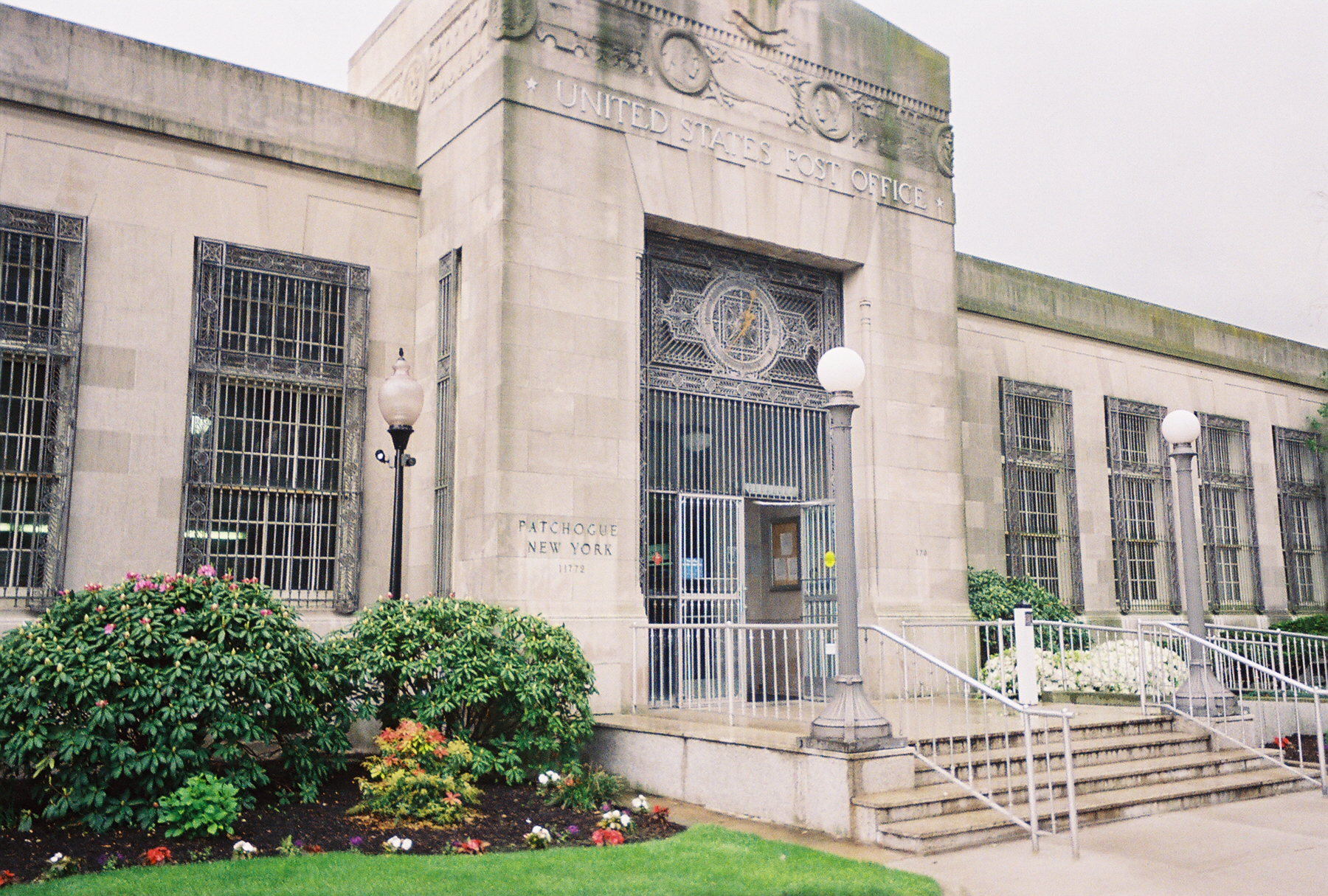 View of the front door of the historic United States Postal Service building on East Main Street in Patchogue, New York.