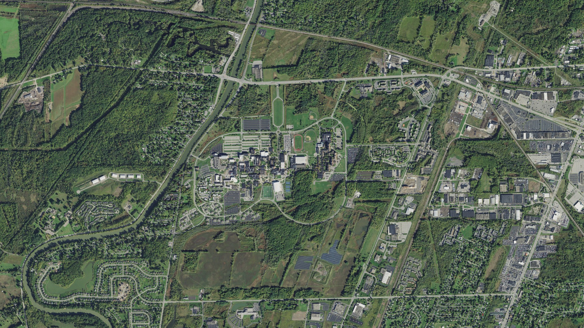 Natural-color aerial photograph of land around Rochester Institute of Technology, New York