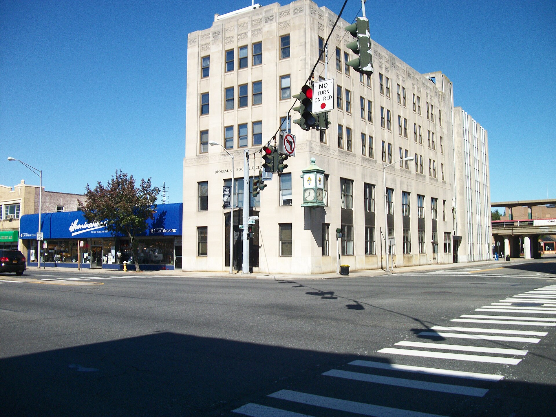 Corporate offices of the Roman Catholic Diocese of Rockville Centre on the northwest corner of Sunrise Highway and North Park Avenue in Rockville Centre, New York. This is south of St. Agnes Cathedral.