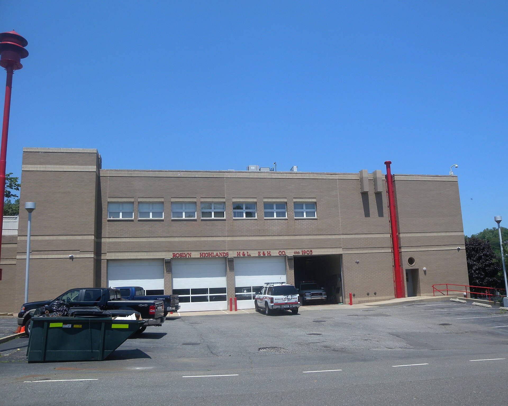 Looking north from Garden Street at firehouse on a sunny midday. — Roslyn Heights, New York