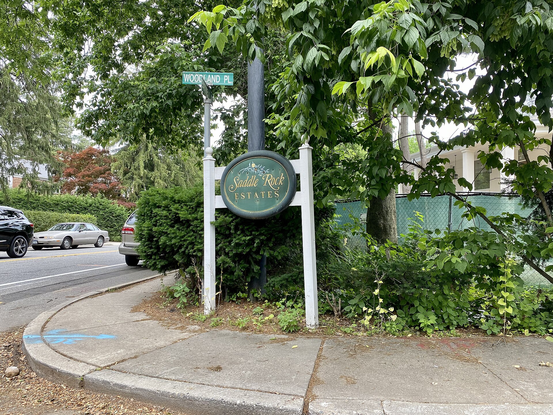 A welcome sign to Saddle Rock Estates, Long Island, New York. This photo was taken on June 11, 2021.