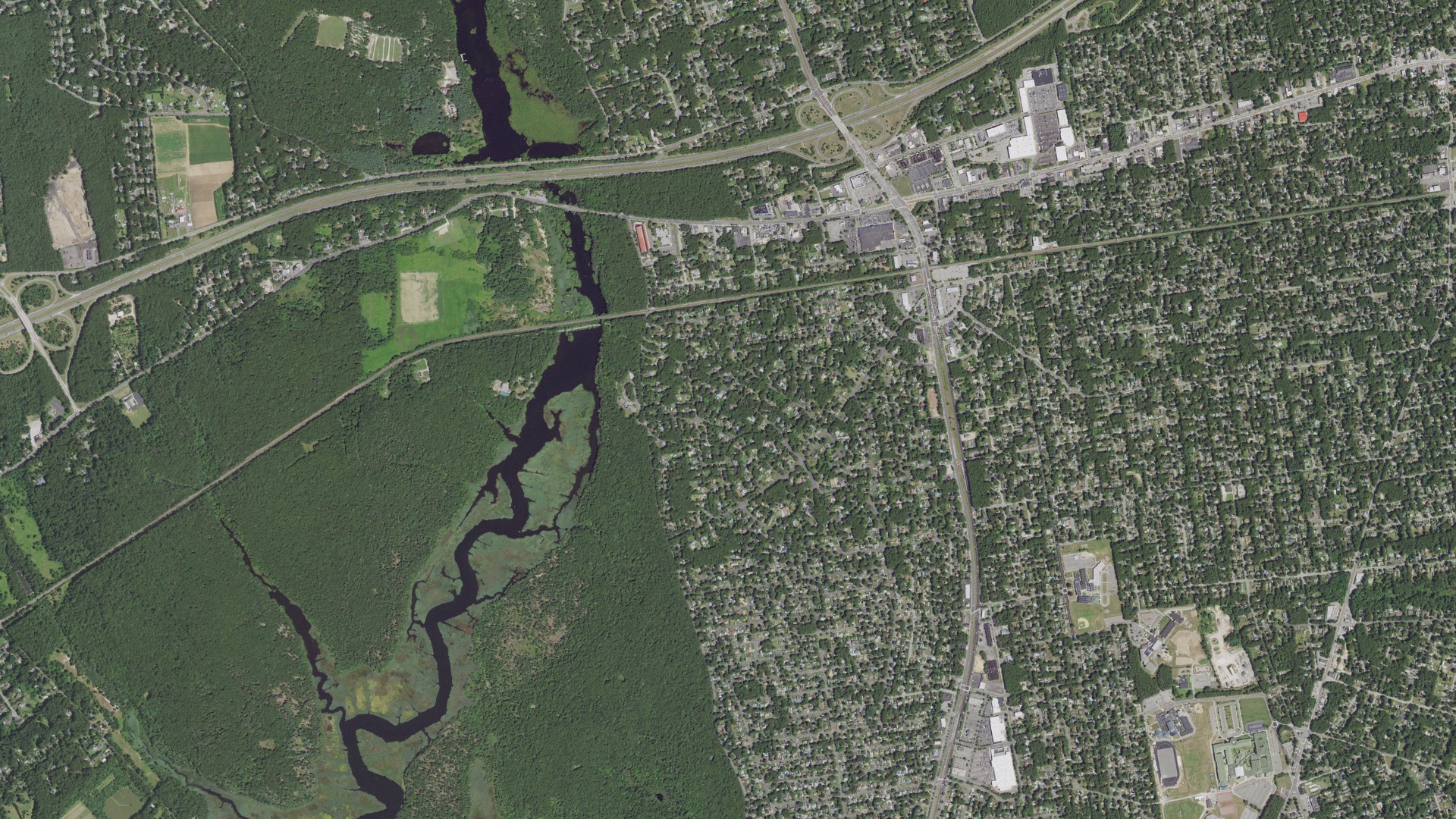 Natural-color aerial photograph of land around Shirley, New York