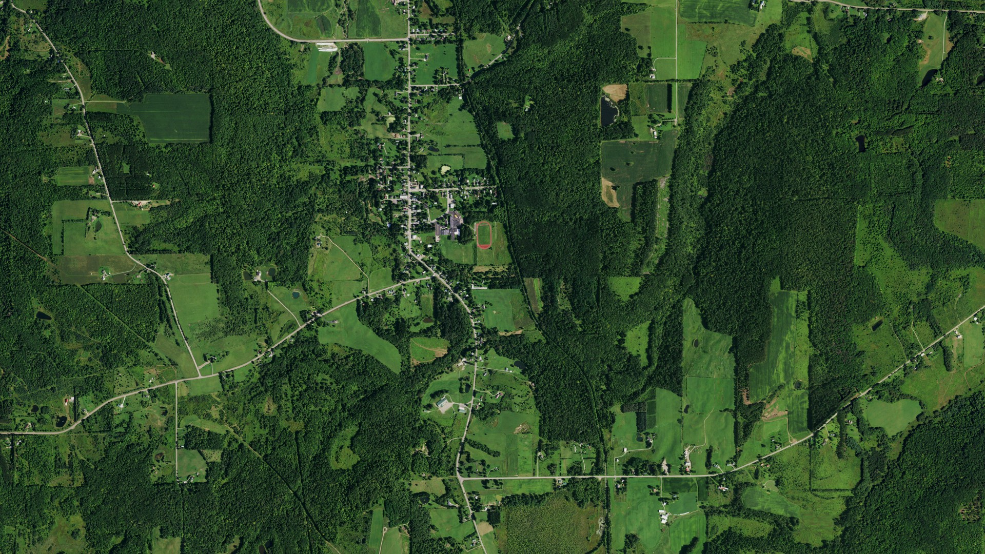 Natural-color aerial photograph of land around West Valley, New York
