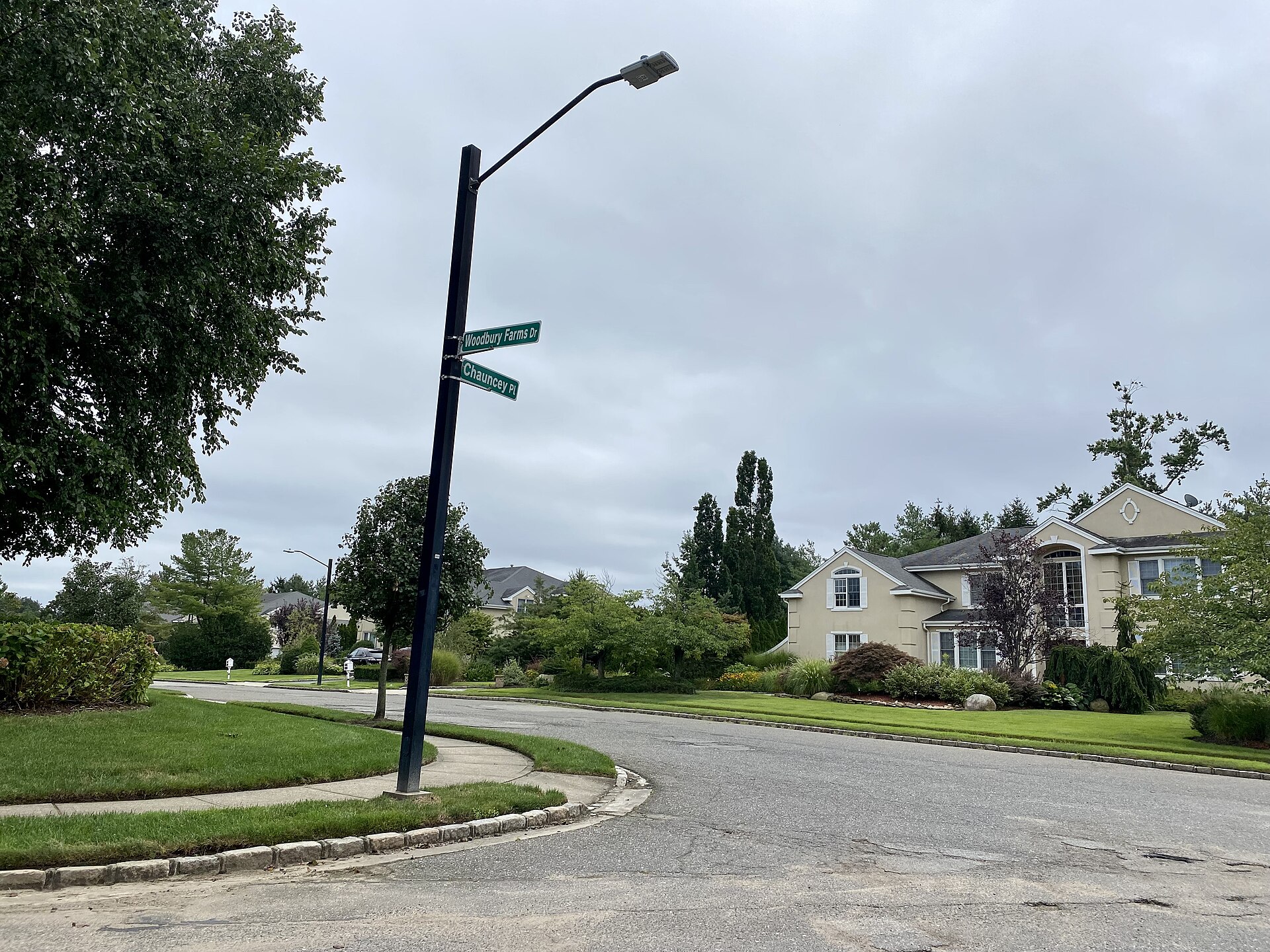 Intersection of Chancey Place and Woodbury Farms Drive in Woodbury, Long Island, New York, looking east-southeast on August 29, 2021.