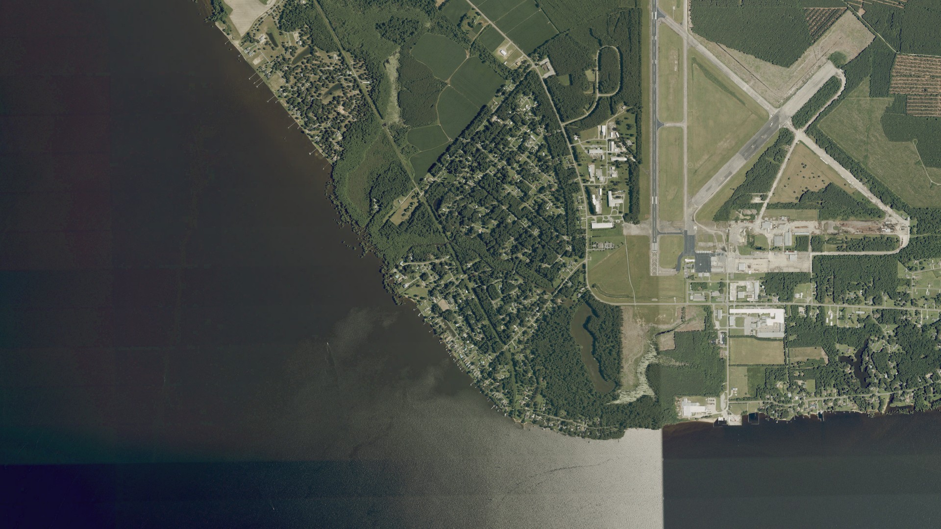 Natural-color aerial photograph of land around Cape Colony, North Carolina