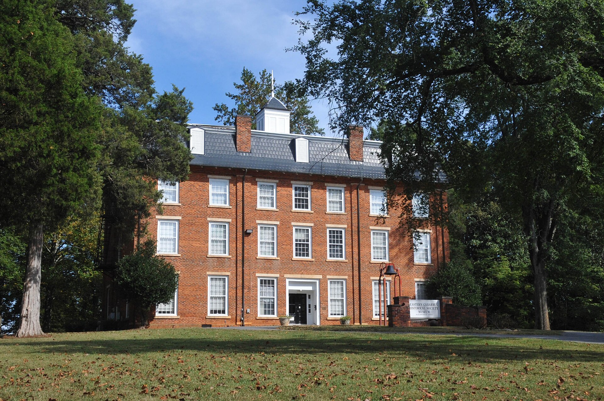 SEVERAL MID-19TH-CENTURY BUILDINGS OF THE WESTERN CAROLINA MALE ACADEMY ESTABLISHED IN 1852. THE HANDSOME THREE-STORY MAIN BUILDING IS NOW THE EASTERN CABARRUS HISTORIC MUSEUM — Mount Pleasant, North Carolina