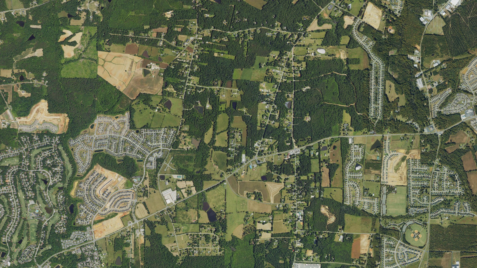 Natural-color aerial photograph of land around Whitsett, North Carolina