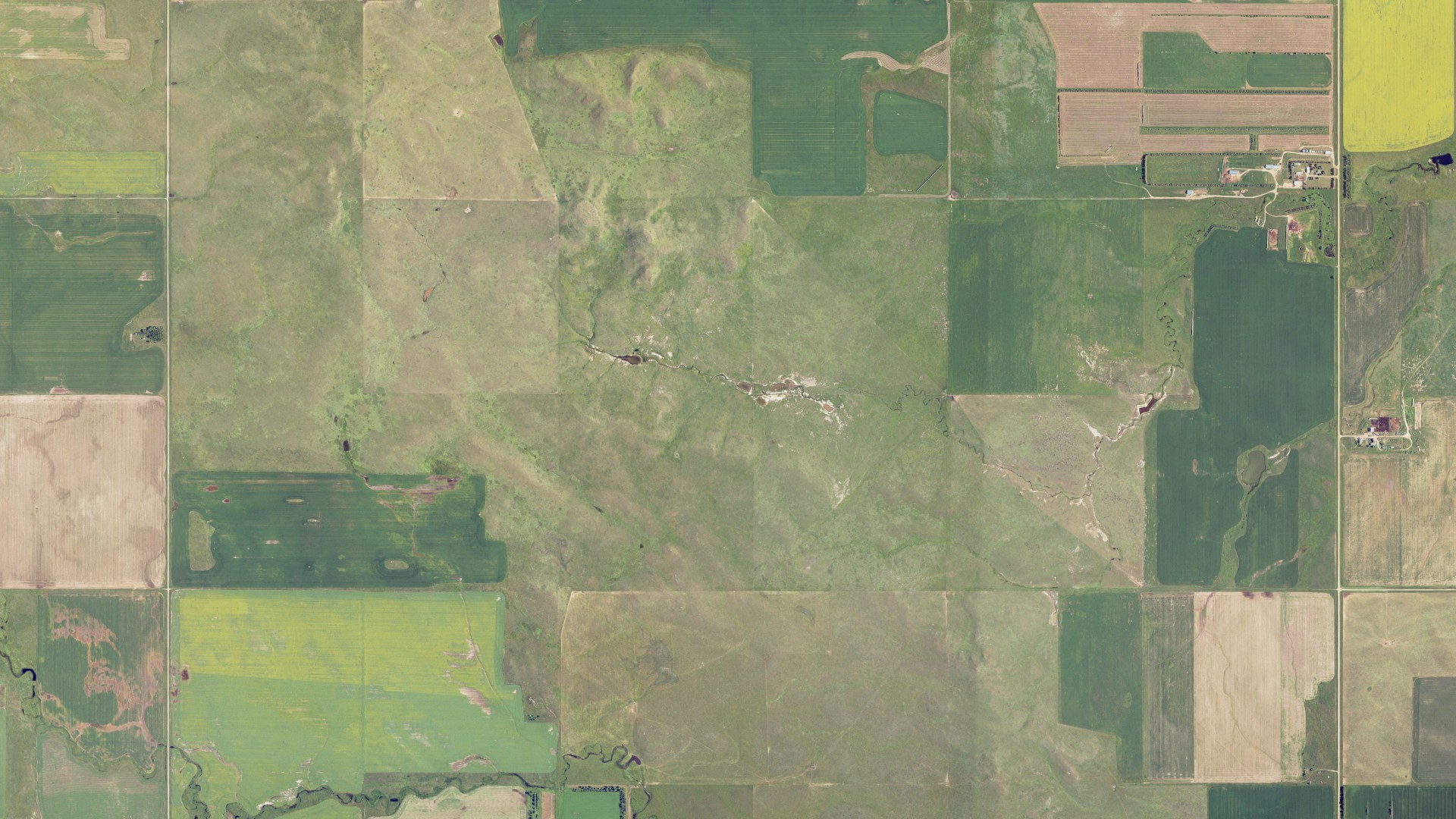 Natural-color aerial photograph of land around Wolf Butte, North Dakota