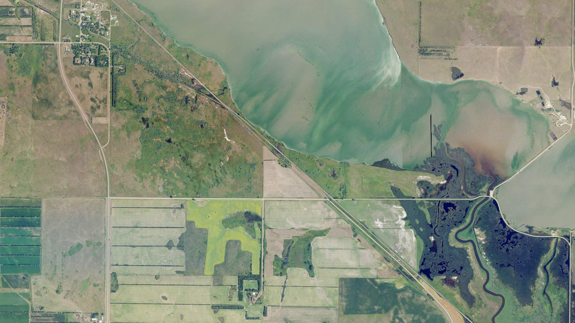 Natural-color aerial photograph of land around Long Lake, North Dakota