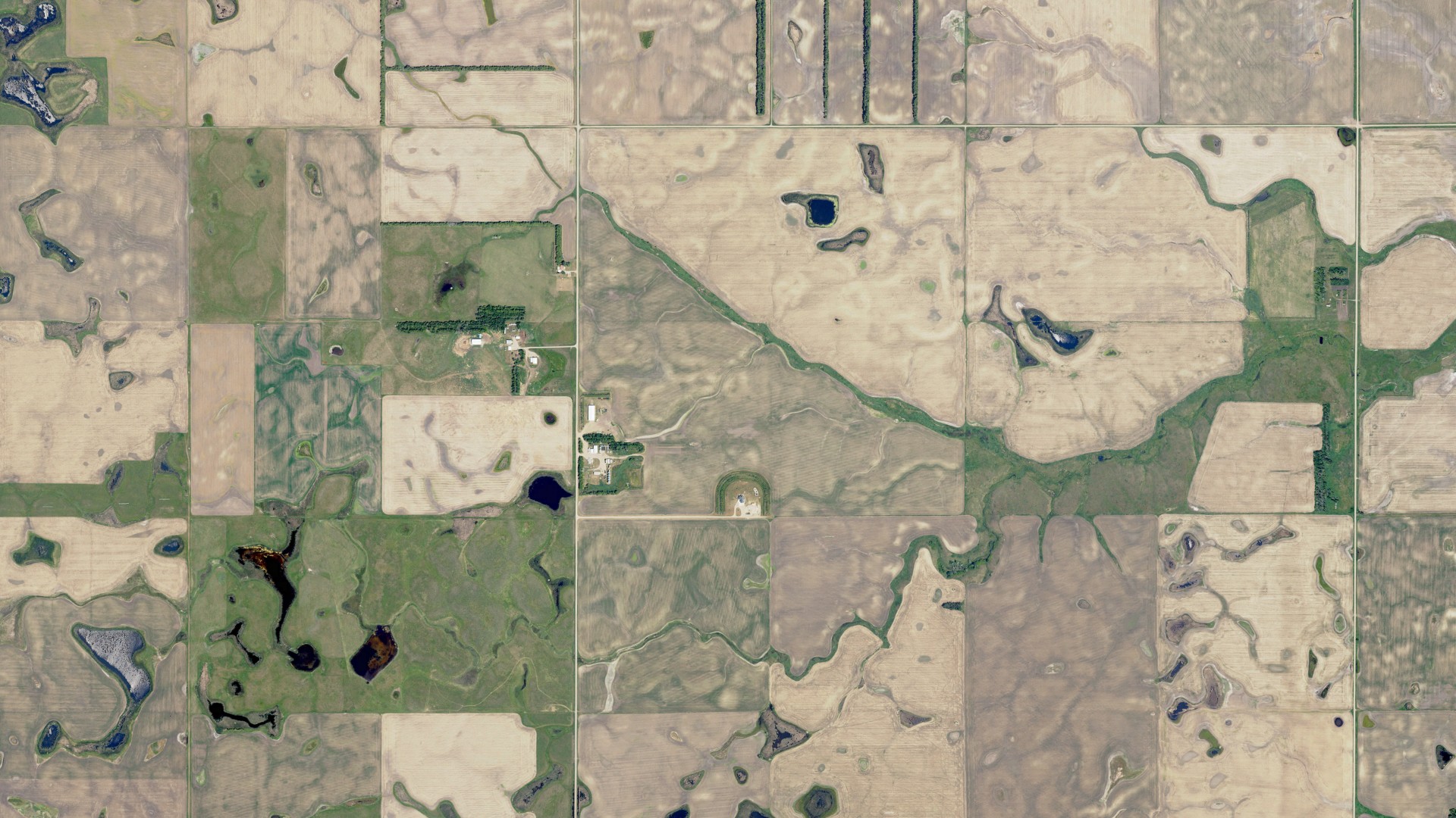 Natural-color aerial photograph of land around Mikkelson, North Dakota