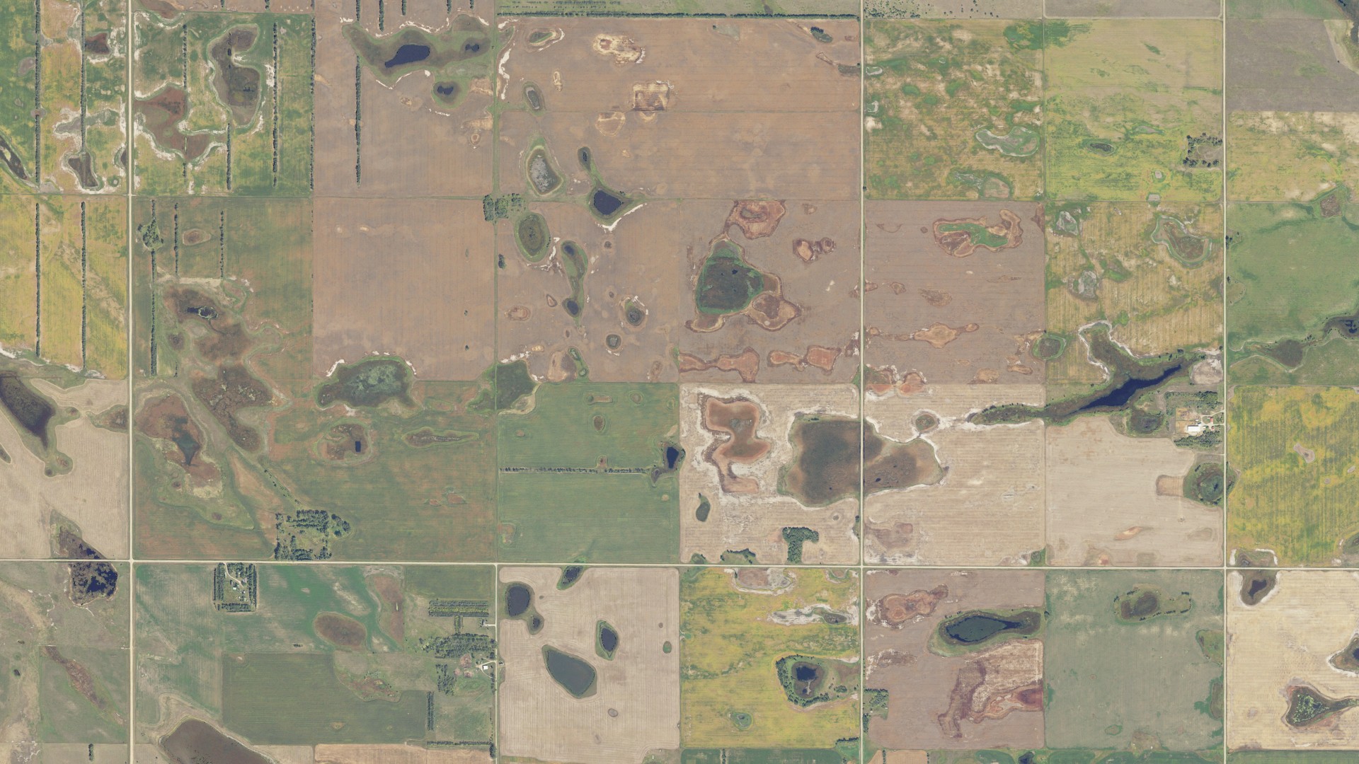 Natural-color aerial photograph of land around Voltaire, North Dakota