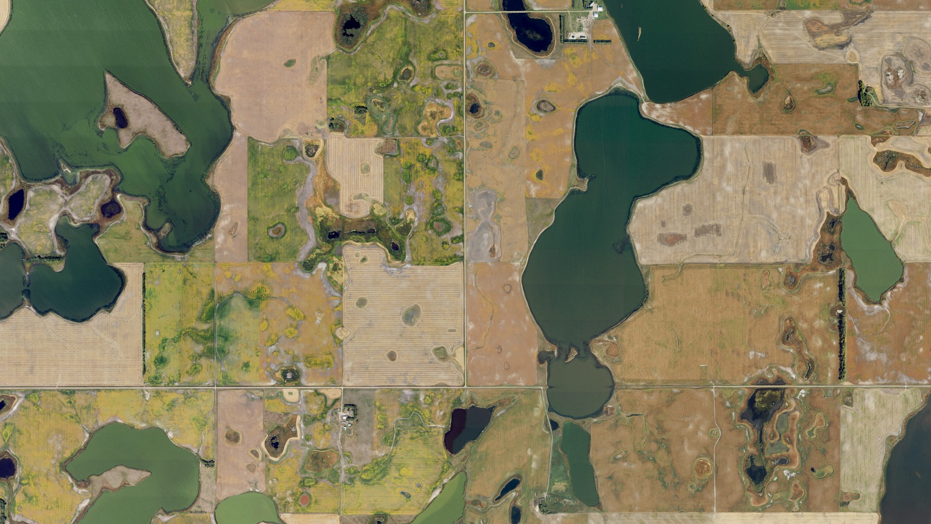 Natural-color aerial photograph of land around Noonan, North Dakota