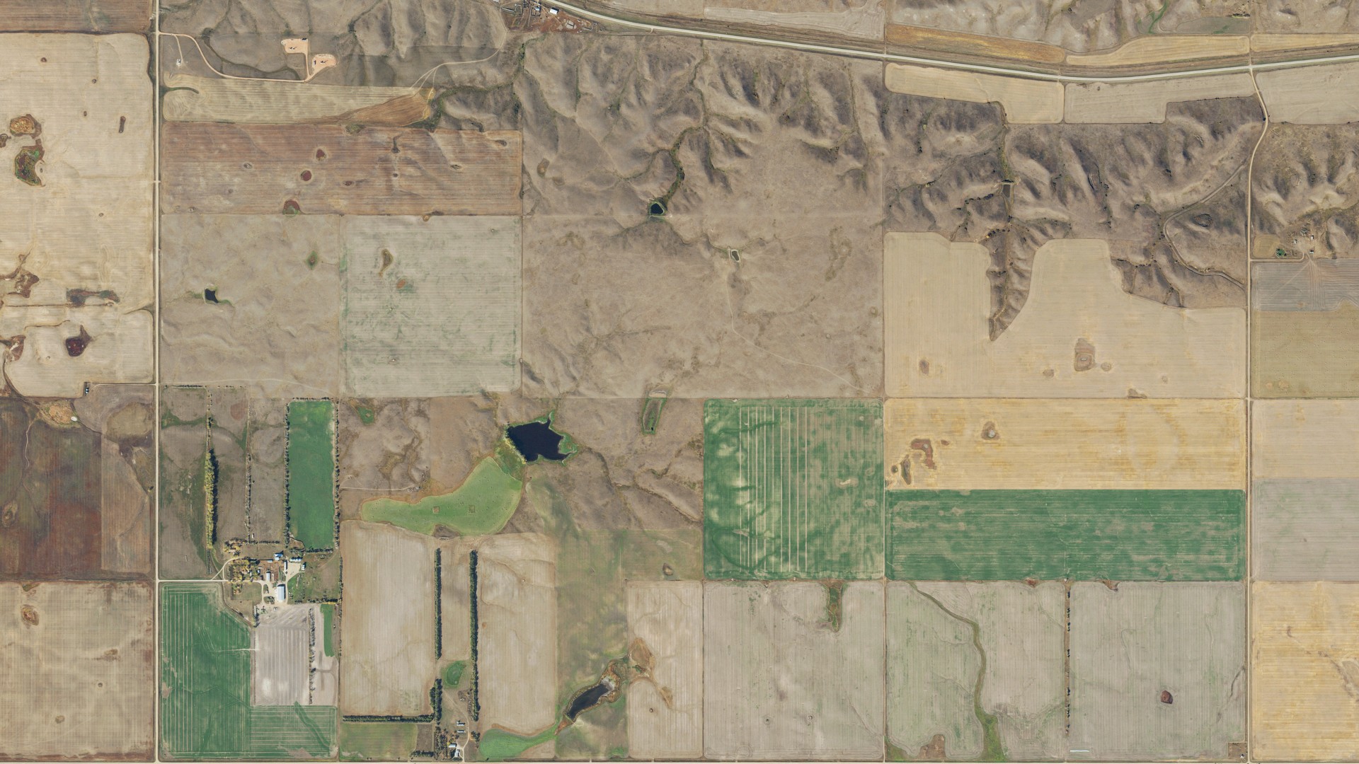 Natural-color aerial photograph of land around Barr Butte, North Dakota