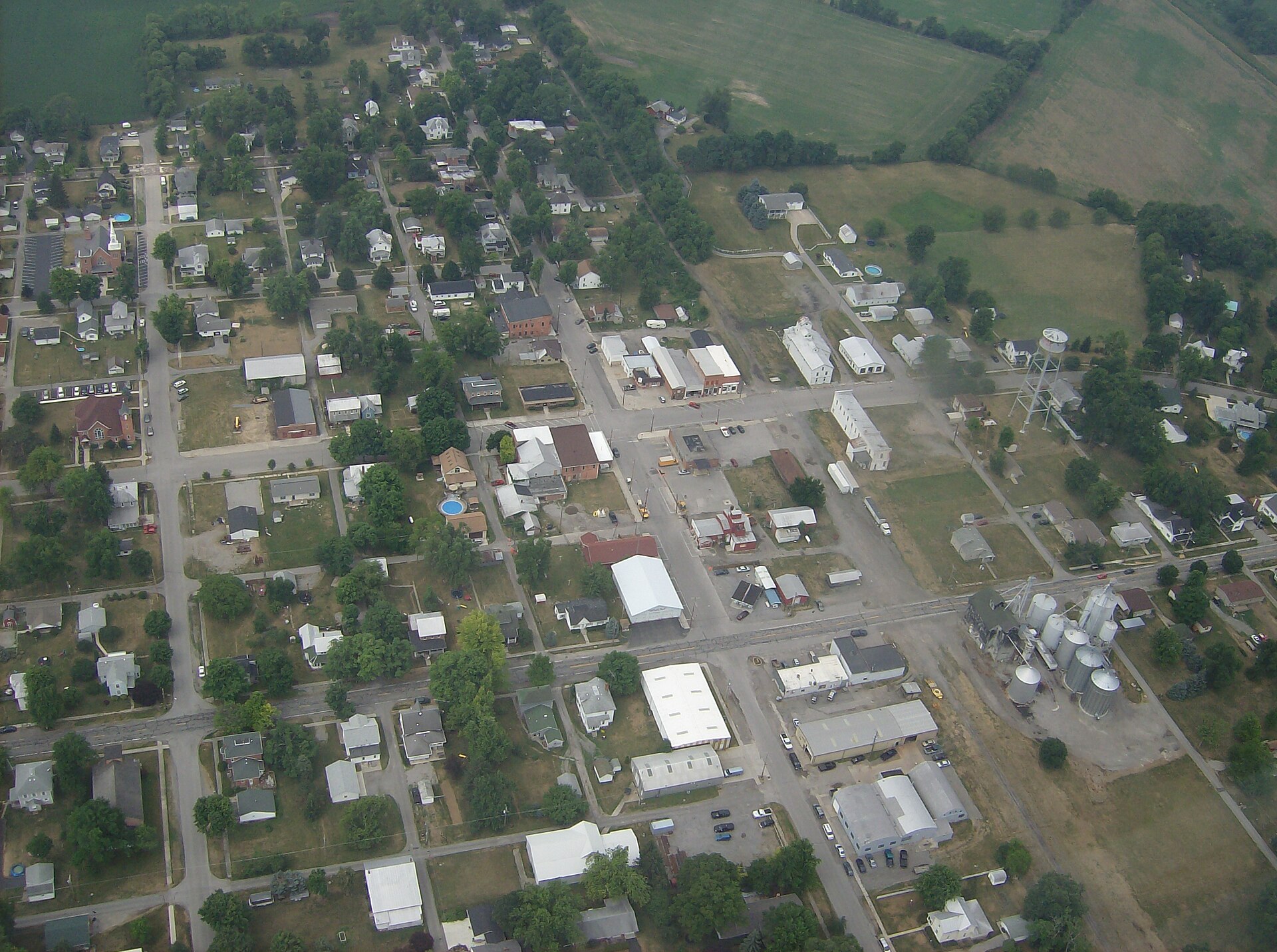 Aerial picture of the "downtown" area of Belle Center, Ohio, United States. Blur is a bug that was hit shortly after takeoff. Taken on June 25, 2007, from a Diamond DA20-C1 Eclipse.