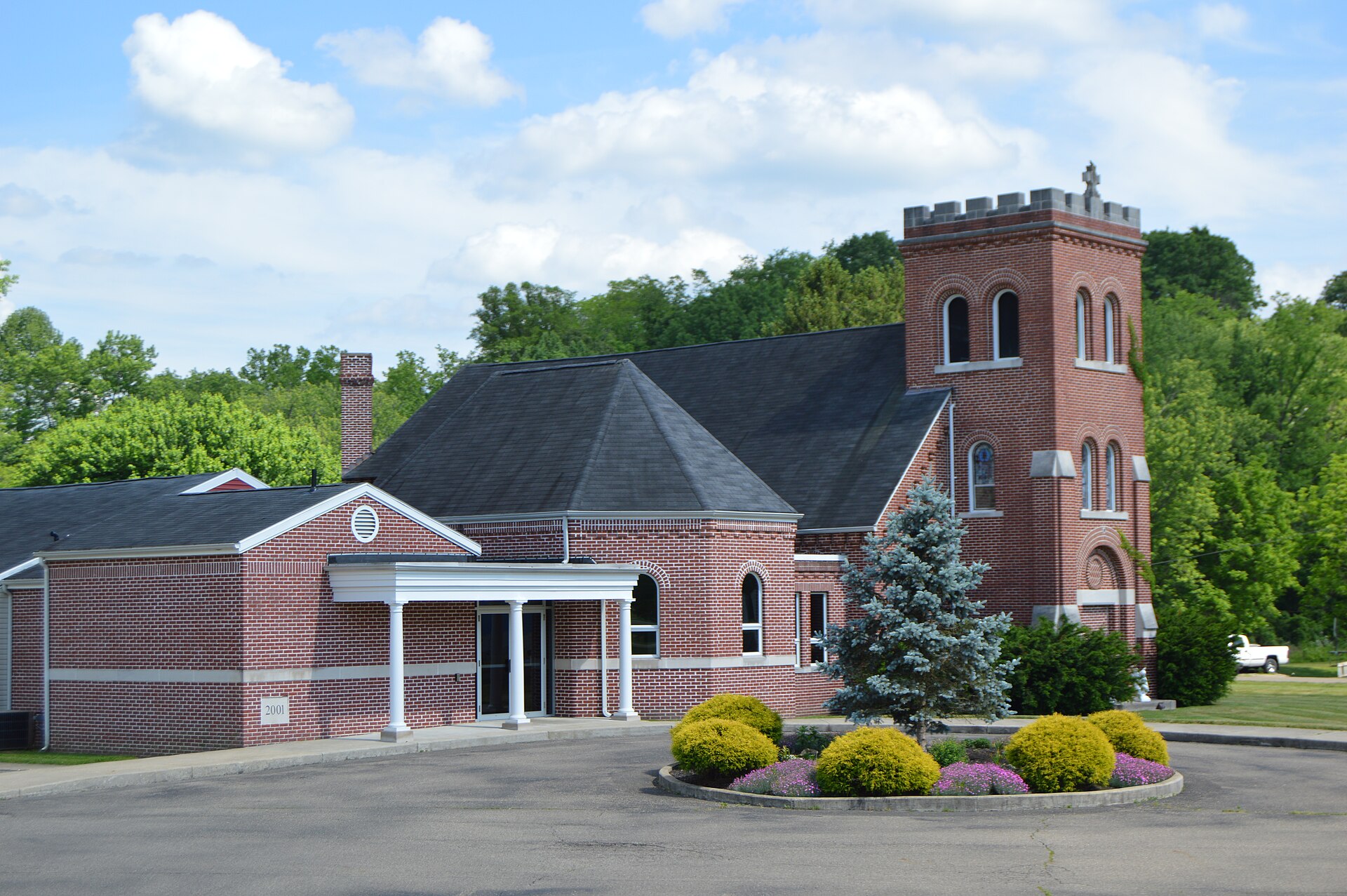 View from the northwest of St. Mary of the Hills Church (formerly St. Patrick Church), located along State Route 78 at 17645 Bank Street in the Athens County section of Buchtel, Ohio, United States.