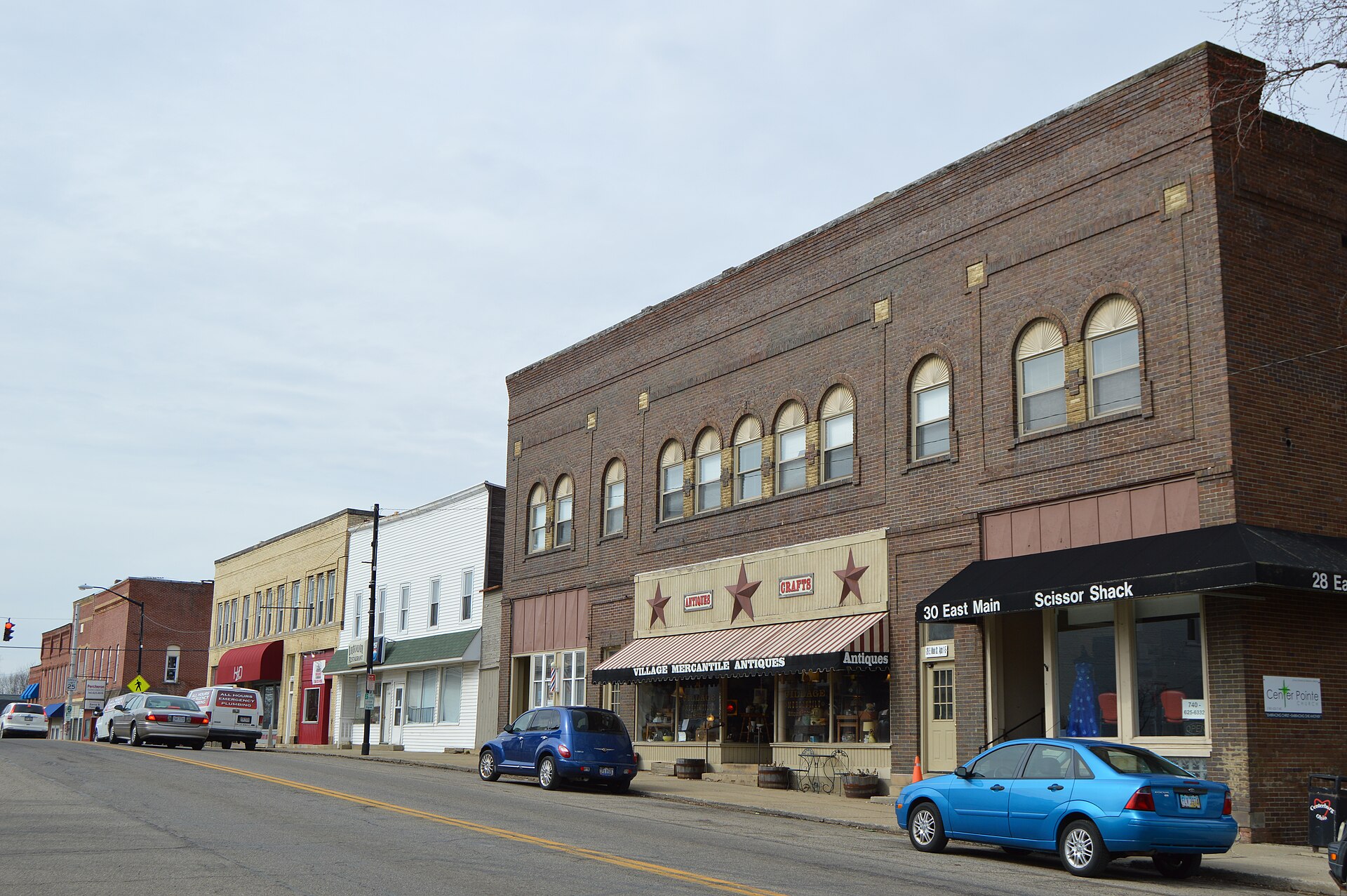 Buildings on the northwestern side of the first block of E. Main Street (U.S. Route 36/State Route 3) in downtown Centerburg, Ohio, United States.