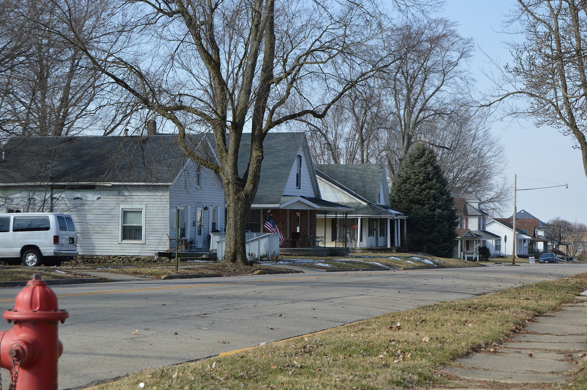 Houses on the southern side of Pike Street (State Route 55) west of Main Street in Christiansburg, Ohio, United States.