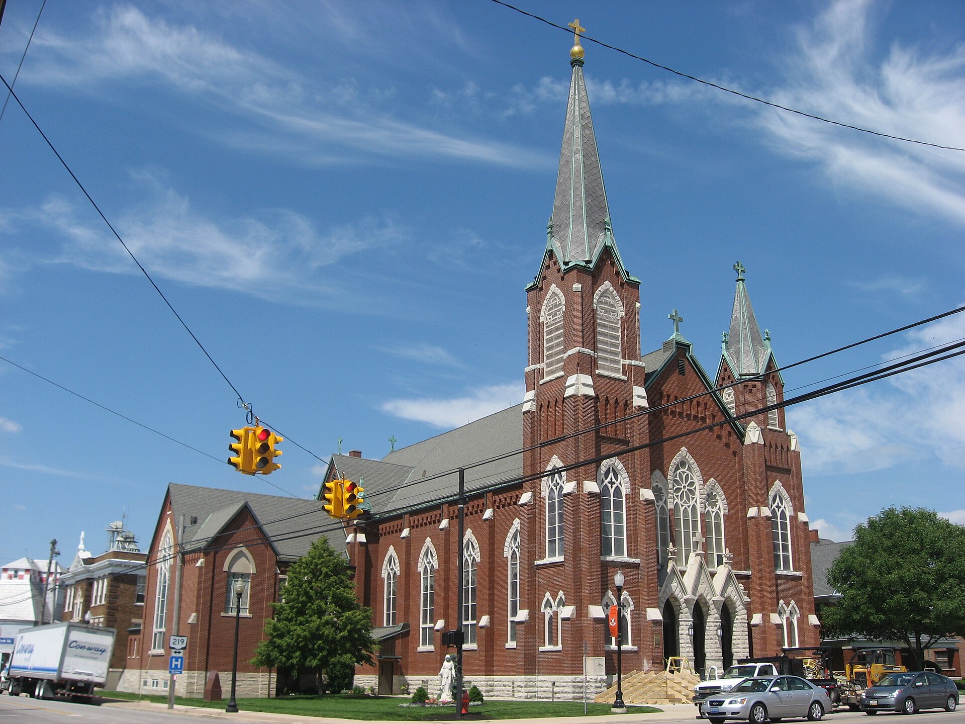 Front and western side of Holy Trinity Catholic Church, located at the intersection of Second (State Route 118) and Main (State Route 219) at the center of Coldwater, Ohio, United States.