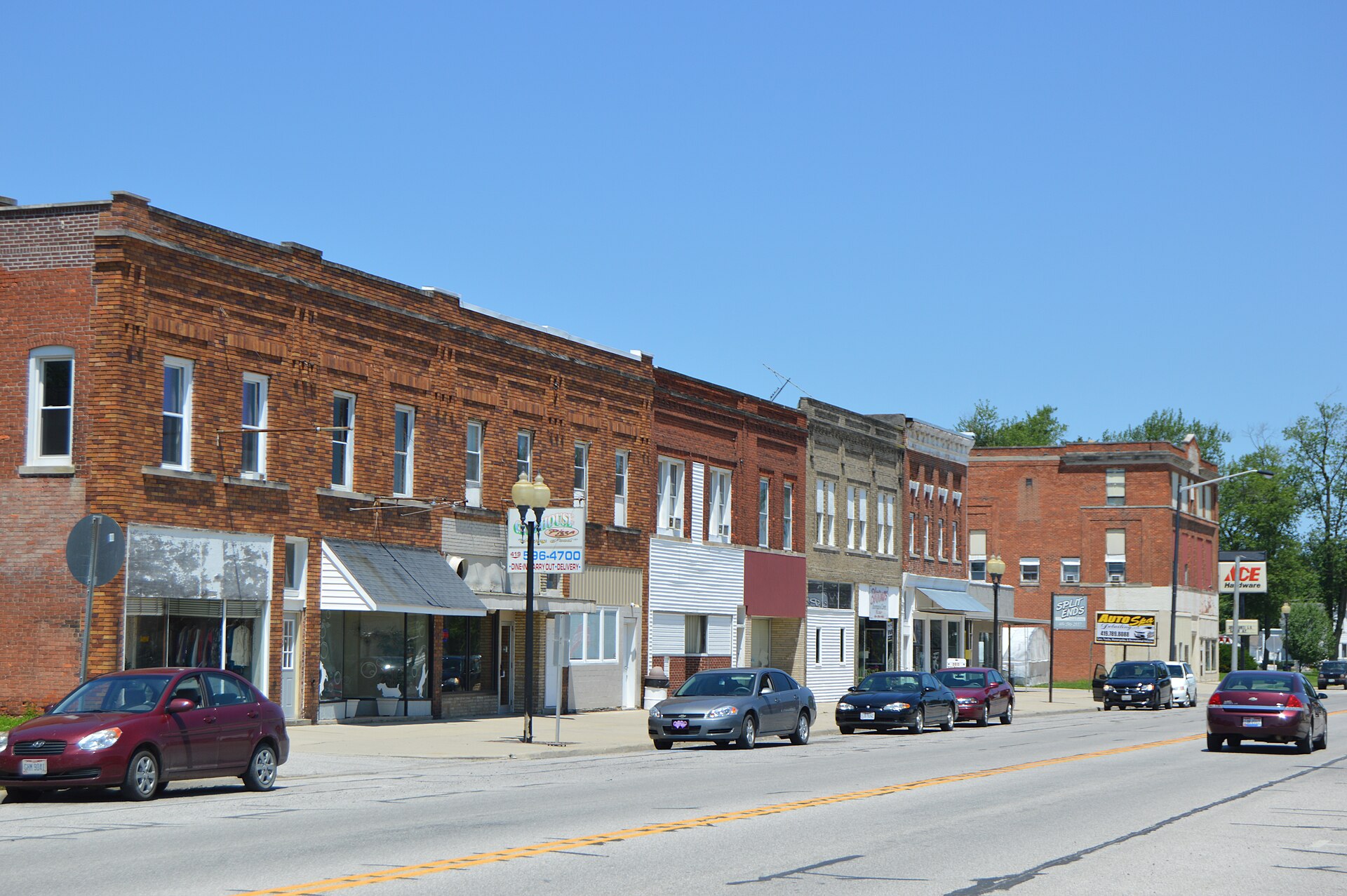 Commercial buildings on the western side of Main Street (State Route 634) in Continental, Ohio, United States; the Rice Street intersection is visible in the distance.