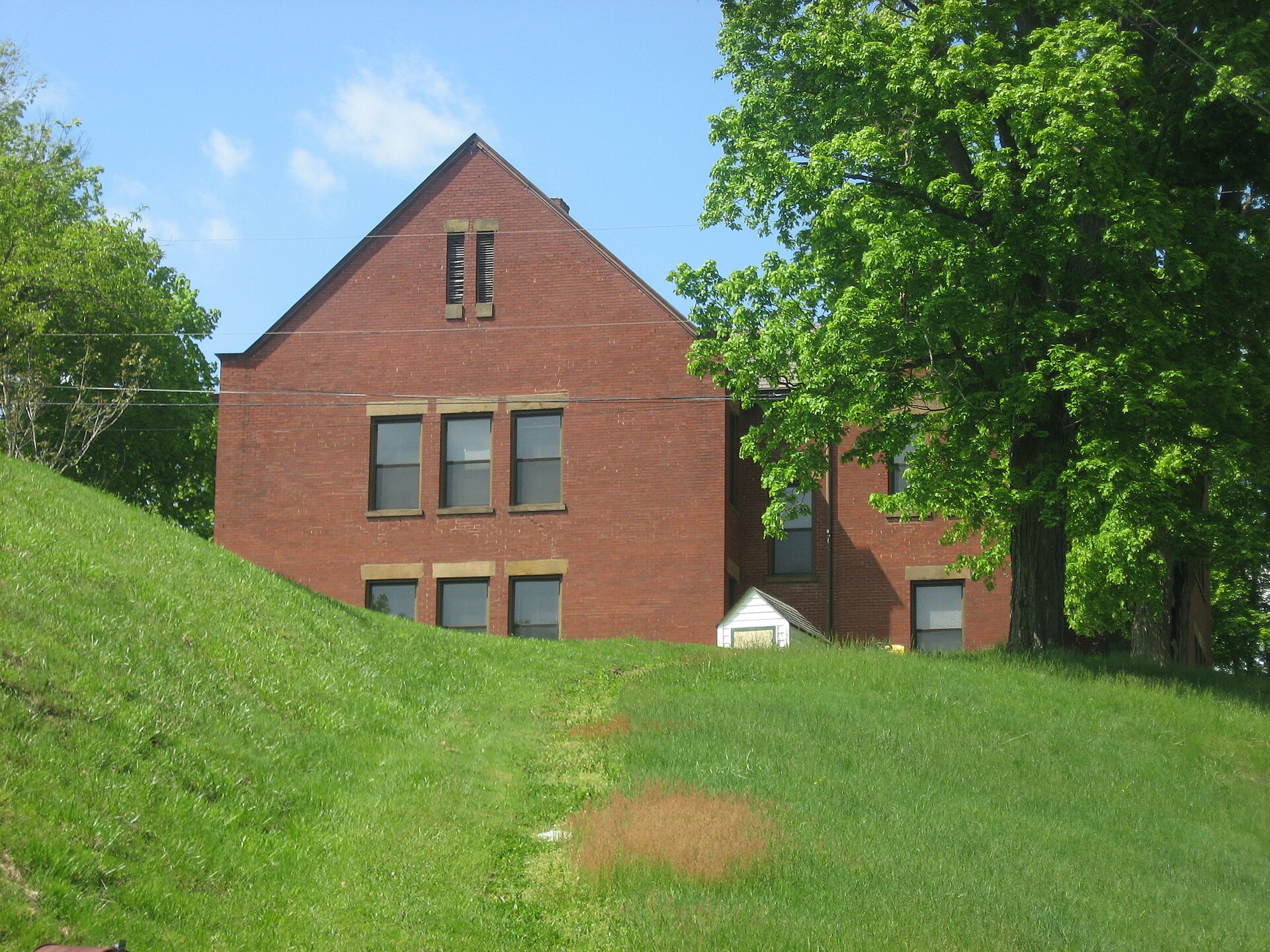 Southern side of the former West School, located on Cemetery Road in Crooksville, Ohio, United States. Built in 1904, it is listed on the National Register of Historic Places.