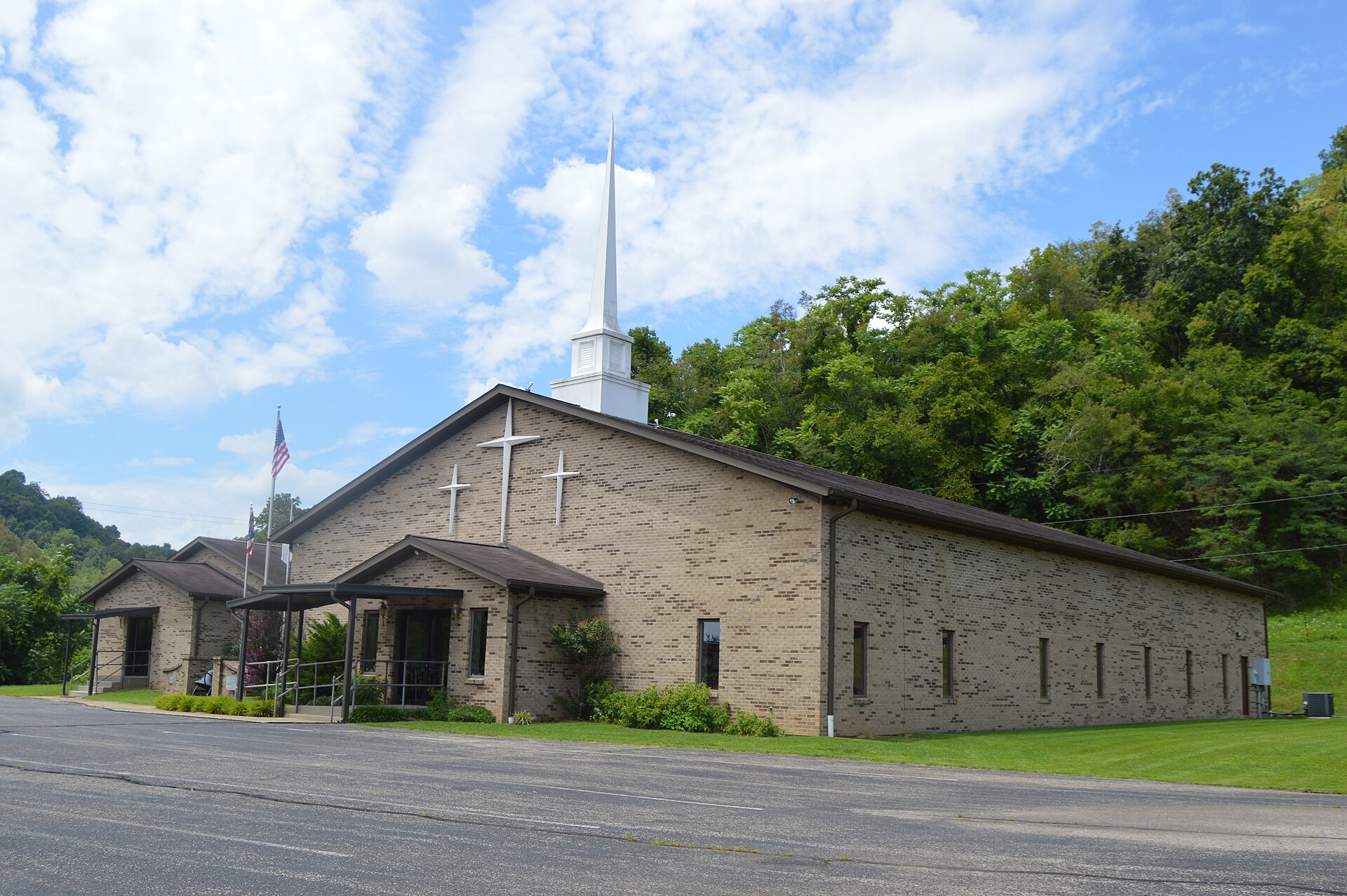 Northern side and front of the Crown City Wesleyan Church, located at 26144 State Route 7 in Crown City, Ohio, United States.