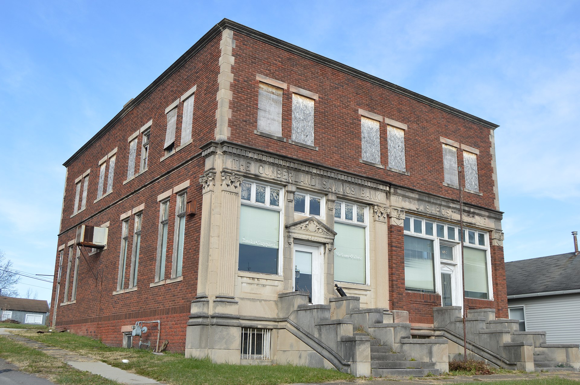 Western side and front of the former Cumberland Savings Bank (left side) and post office (right side), located on Main Street (State Routes 146/340) at Bank Street in Cumberland, Ohio, United States.