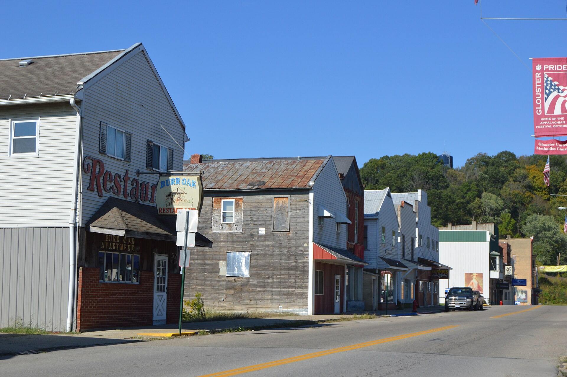 Buildings on the western side of High Street (State Route 13), south of the Republic Avenue intersection, in Glouster, Ohio, United States.