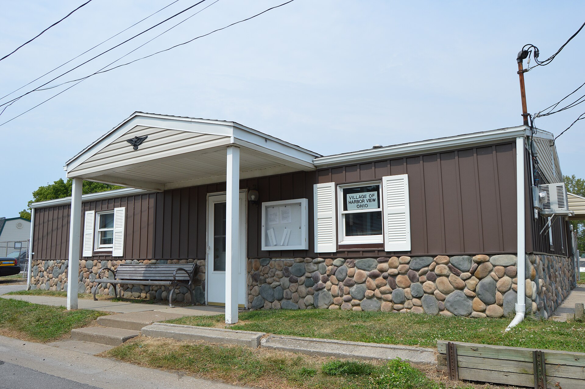 Front of the municipal building in Harbor View, Ohio, United States, located at 327 Lakeview Avenue. Despite the appearance, this is a concrete-block building with a newly applied stone-and-steel facade.