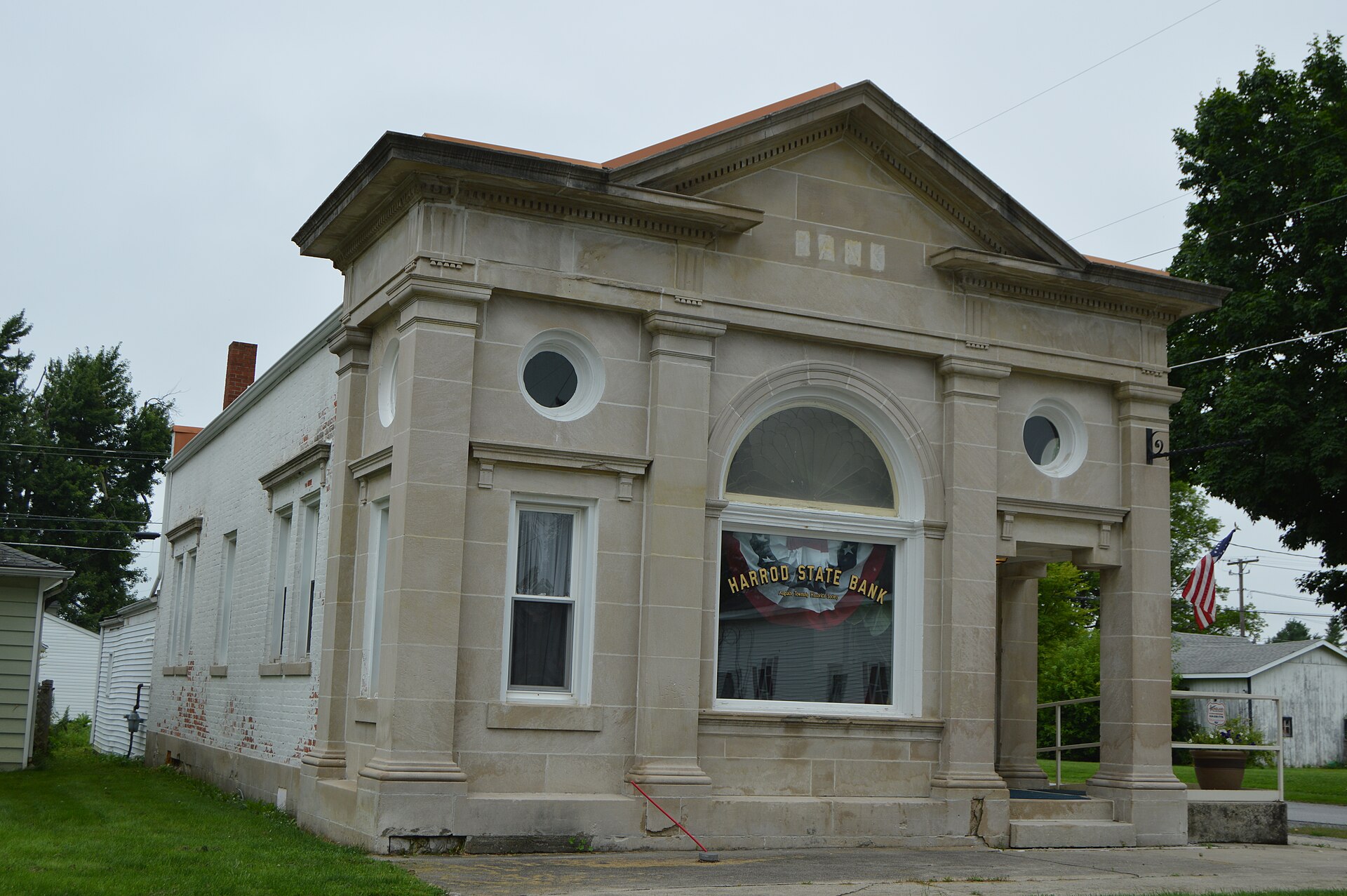 Front and southern side of the former Harrod State Bank (now the local historical society), located at 100 S. Main Street in Harrod, Ohio, United States. It was built in 1910.