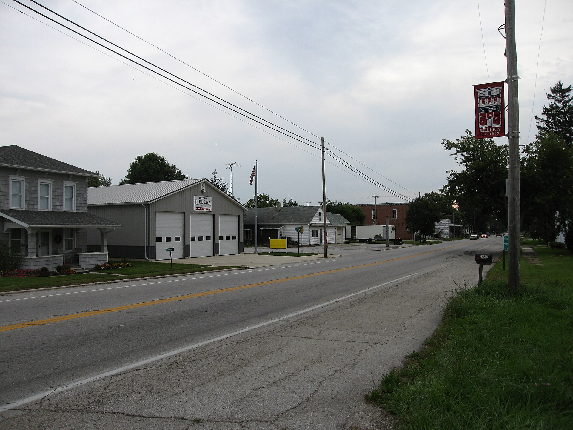 Photograph of the village of Helena, Ohioen, taken at street level from Main Street, looking East on U.S. Route 6.