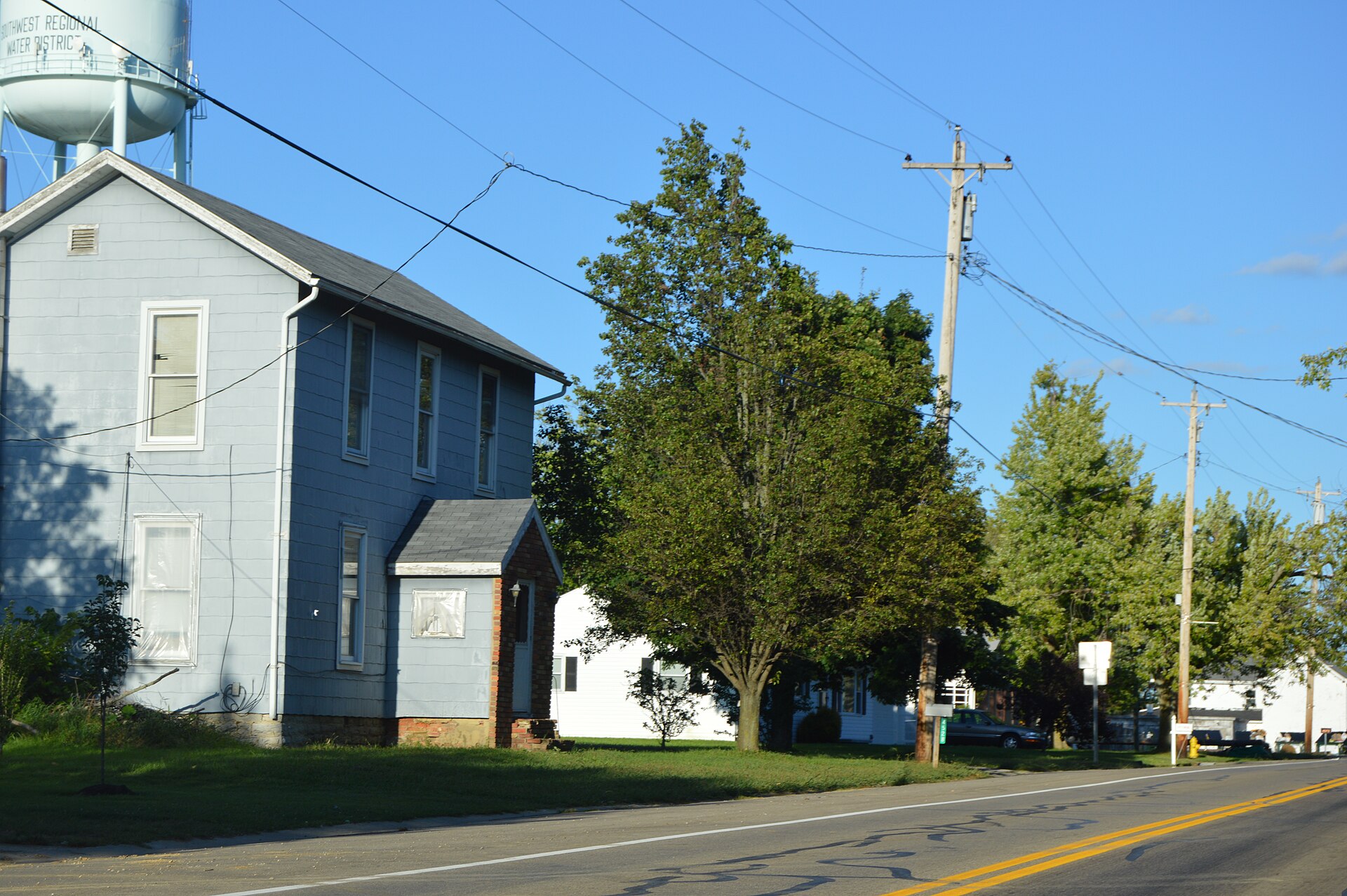 Houses on the northern side of State Route 744 at the western edge of Jacksonburg, Ohio, United States.