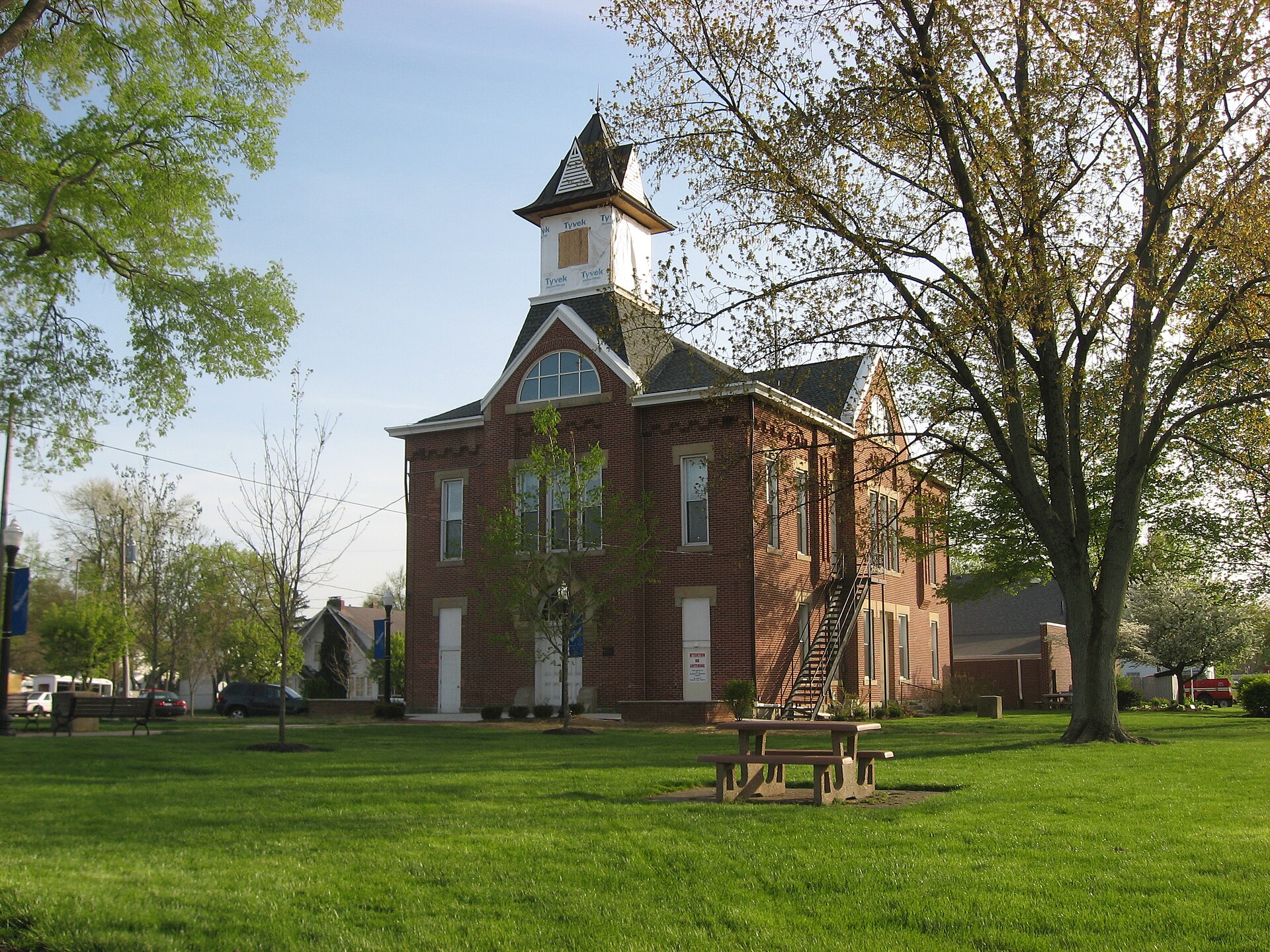 Front and northern side of the Monroe Township Hall-Opera House, located at 1 S. Main Street in downtown Johnstown, Ohio, United States. Built in 1884, it is listed on the National Register of Historic Places.