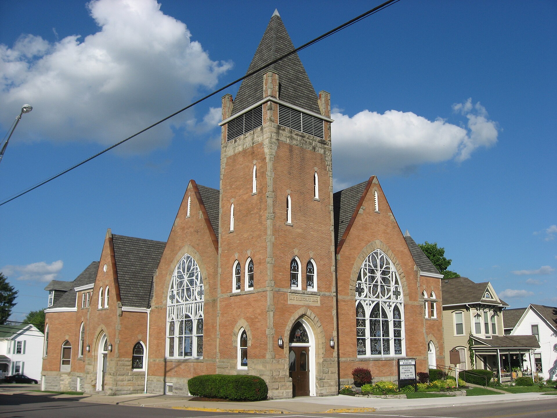 Front and side of the Mechanicsburg United Methodist Church, located on the eastern corner of the intersection of Main (State Route 29) and Race Streets in Mechanicsburg, Ohio, United States.