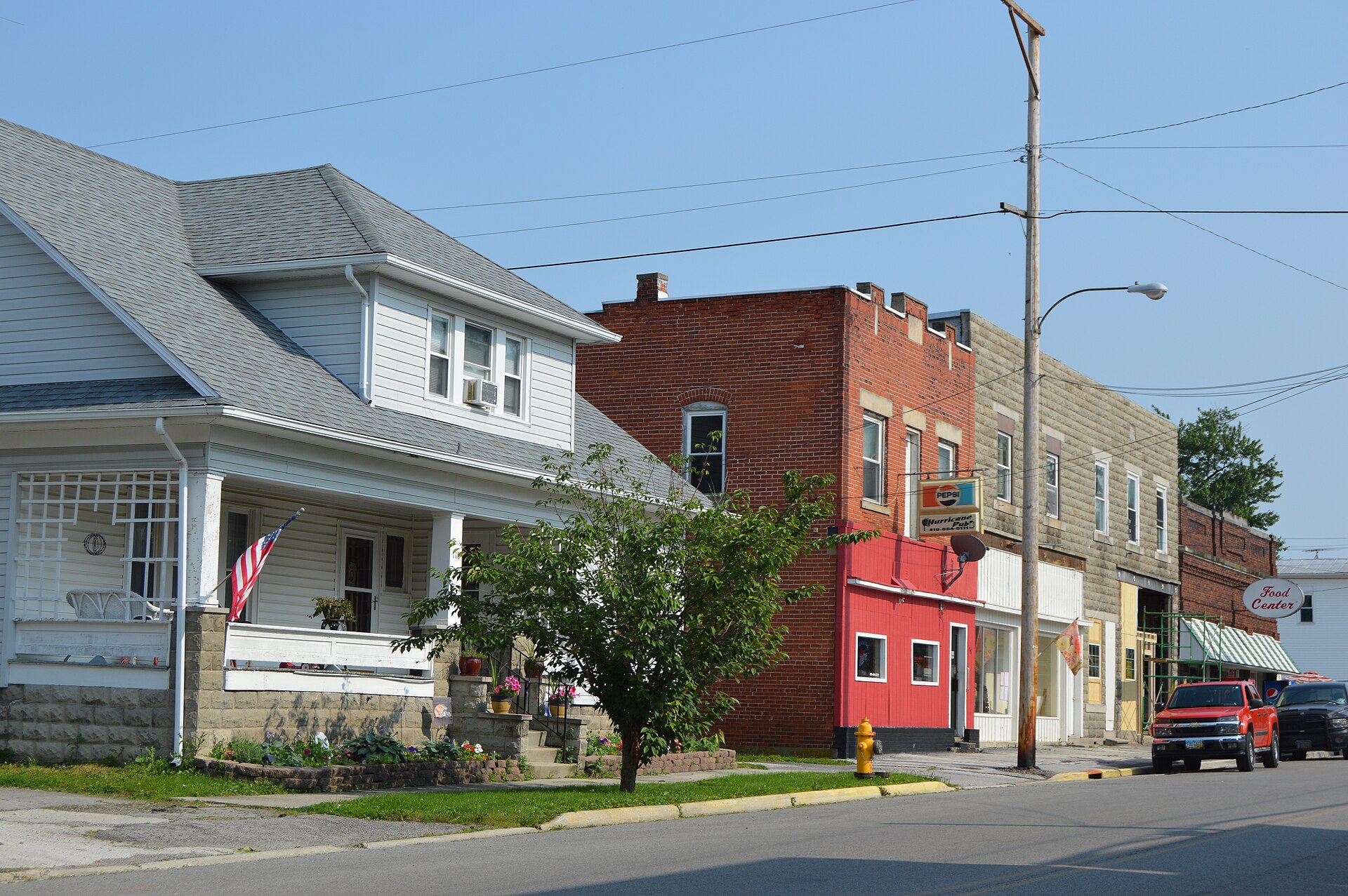 Commercial buildings and a house on the eastern side of the 100 block of N. Main Street (State Route 37) in Mount Blanchard, Ohio, United States.