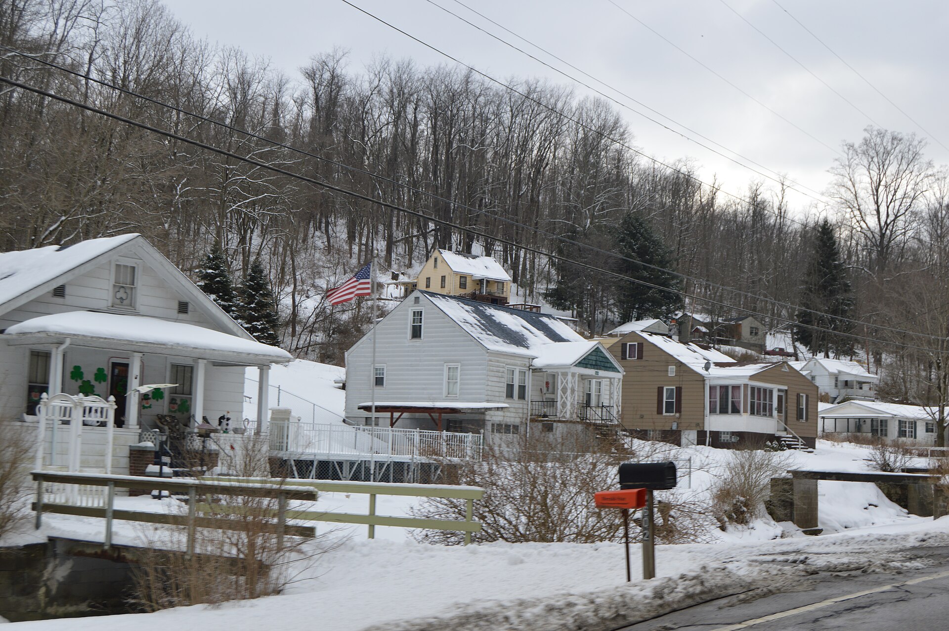 Houses on the southern side of New Alexandria Road (State Route 151) in New Alexandria, Ohio, United States.