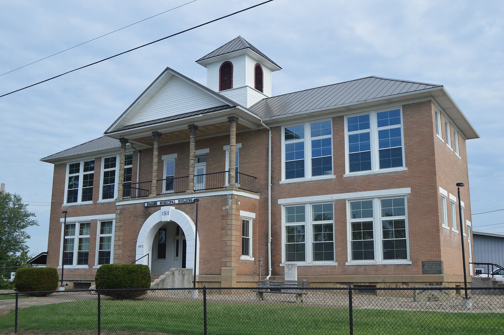 Front of the former Racine Public School (now the village hall), located at the intersection of Fifth (State Route 124) and Main Streets in Syracuse, Ohio, United States. It was built in 1911.