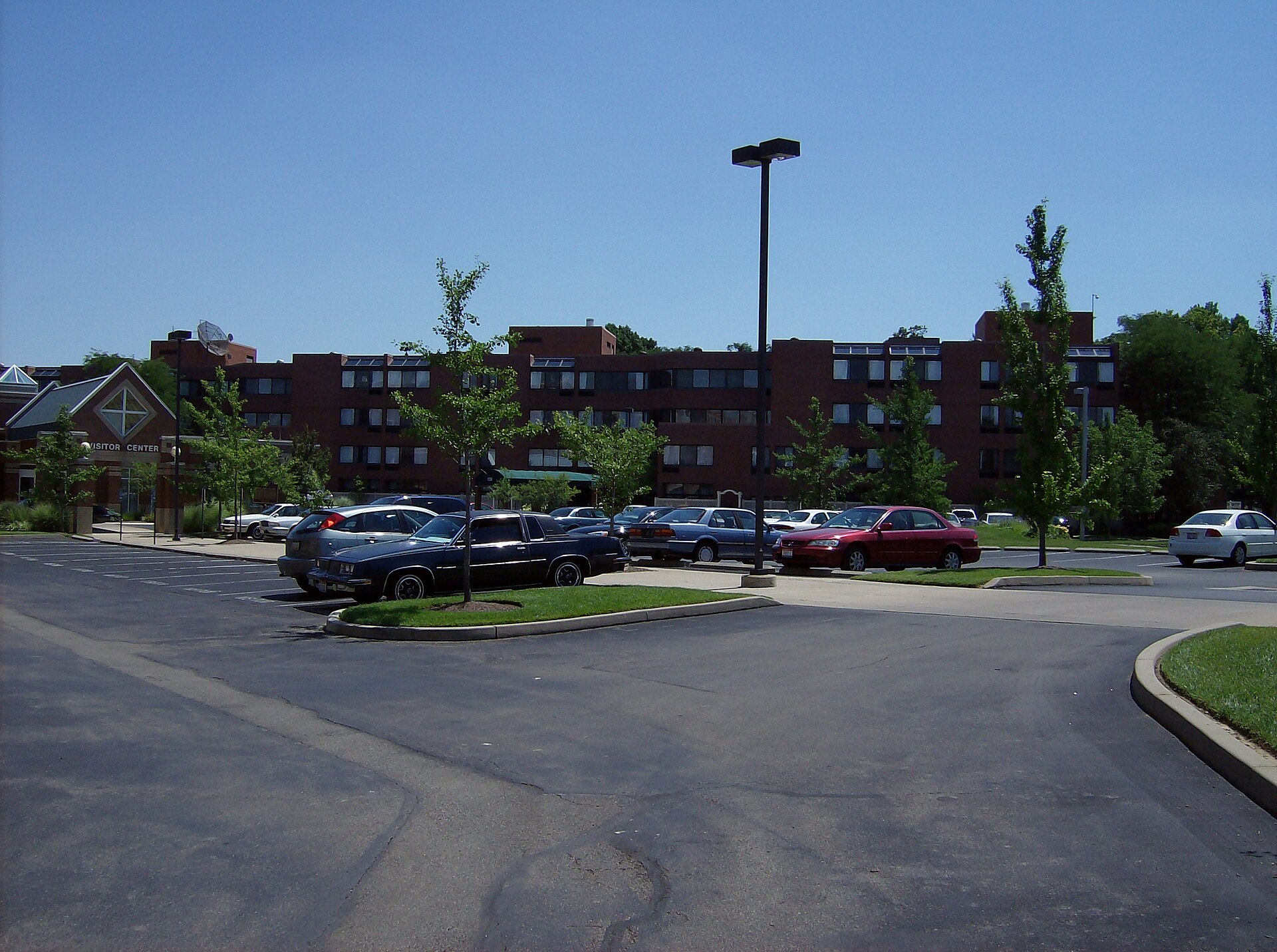 Parking lots at the center of Maple Knoll Village in Springdale, Ohio, Ohio, United States. Picture taken at Breeze Manor, looking toward the visitors' entrance and Beecher Place.