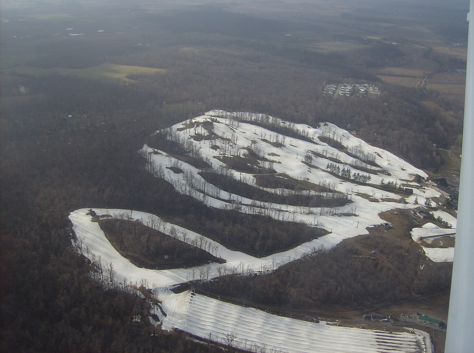 Aerial view of the small ski resort of Mad River Mountain and village of Valley Hi in southern Jefferson Township, Logan County, Ohio, United States, taken from a Diamond Eclipse light airplane.