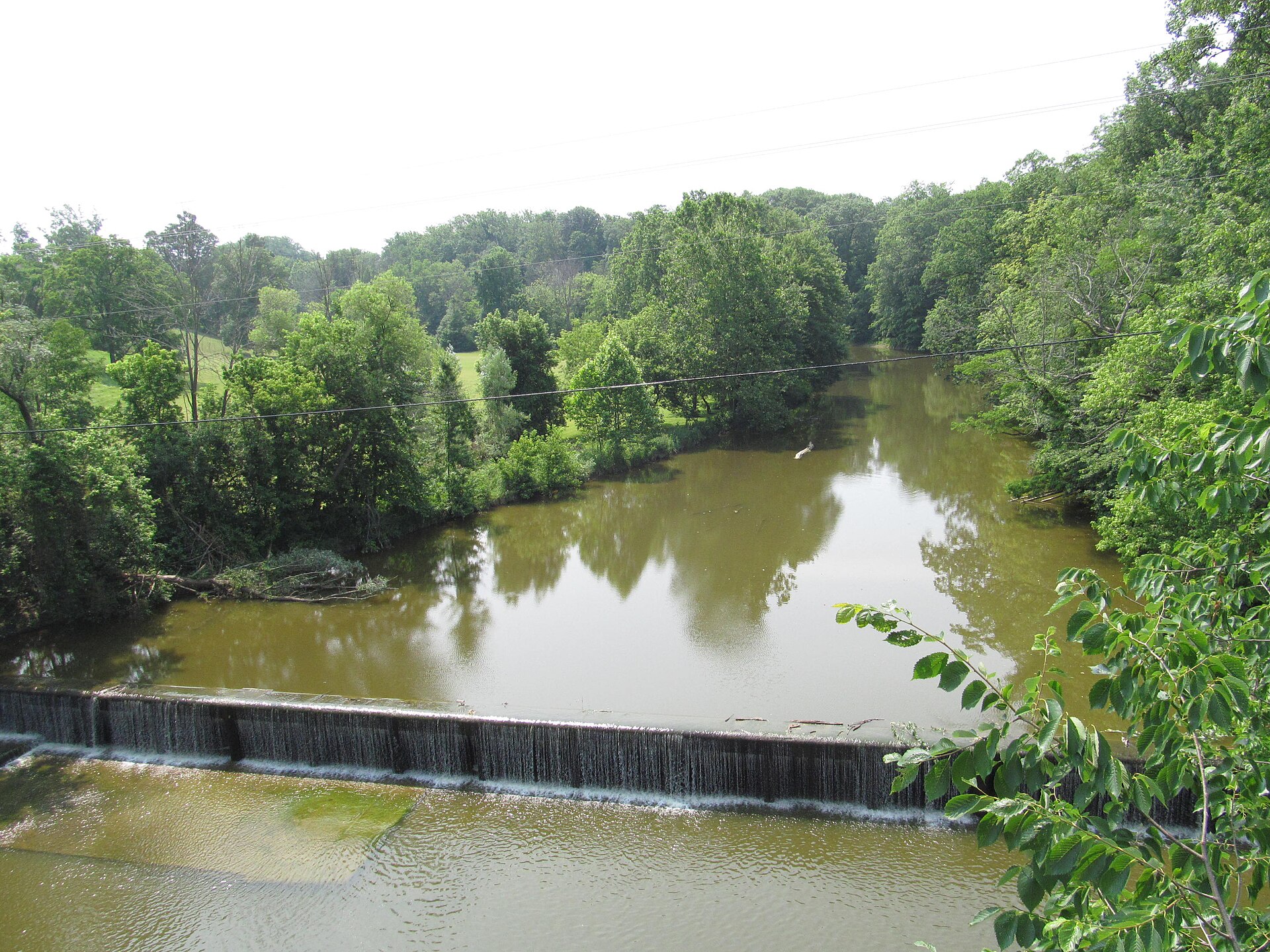 A dam on the Vermilion River, seen looking south from Main Street (U.S. Route 20) in eastern Wakeman, Ohio, United States.
