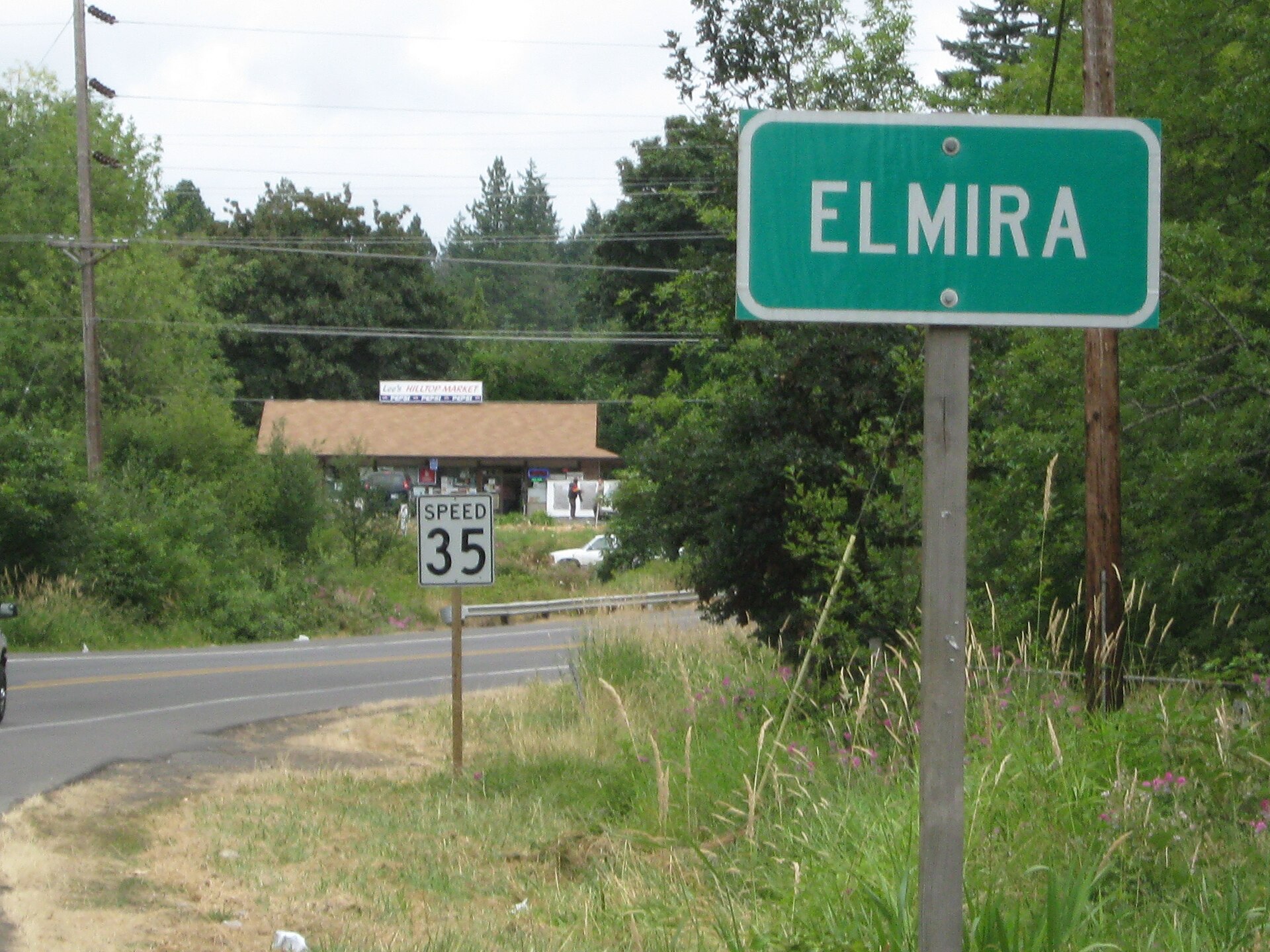 Approaching Elmira, Oregon, USA on Territoral Road from the south. Hilltop Market is in the distance. Fern Ridge Wildlife Area to the right.
