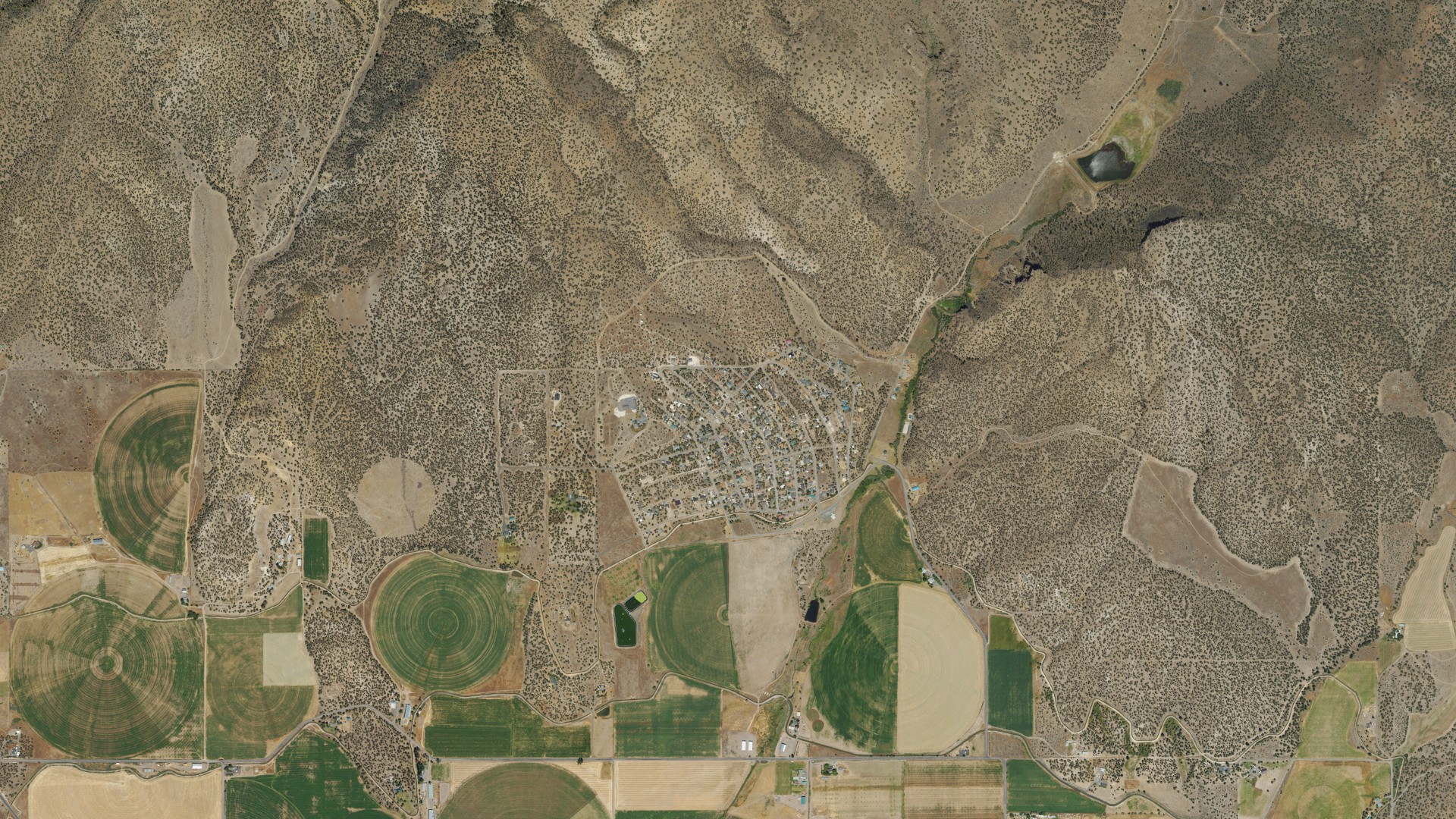 Natural-color aerial photograph of land around Ochoco West, Oregon