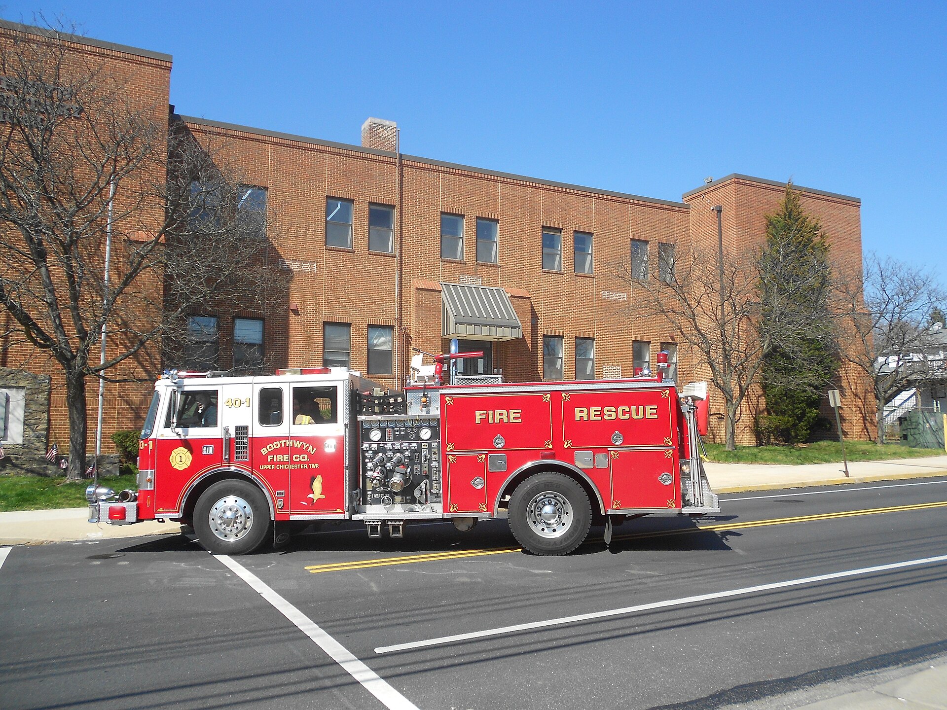 Boothwyn Fire Department engine in front of the Boothwyn Elementary School. The engine is turning around to back into the Firehouse which is across the street from the school — Pennsylvania