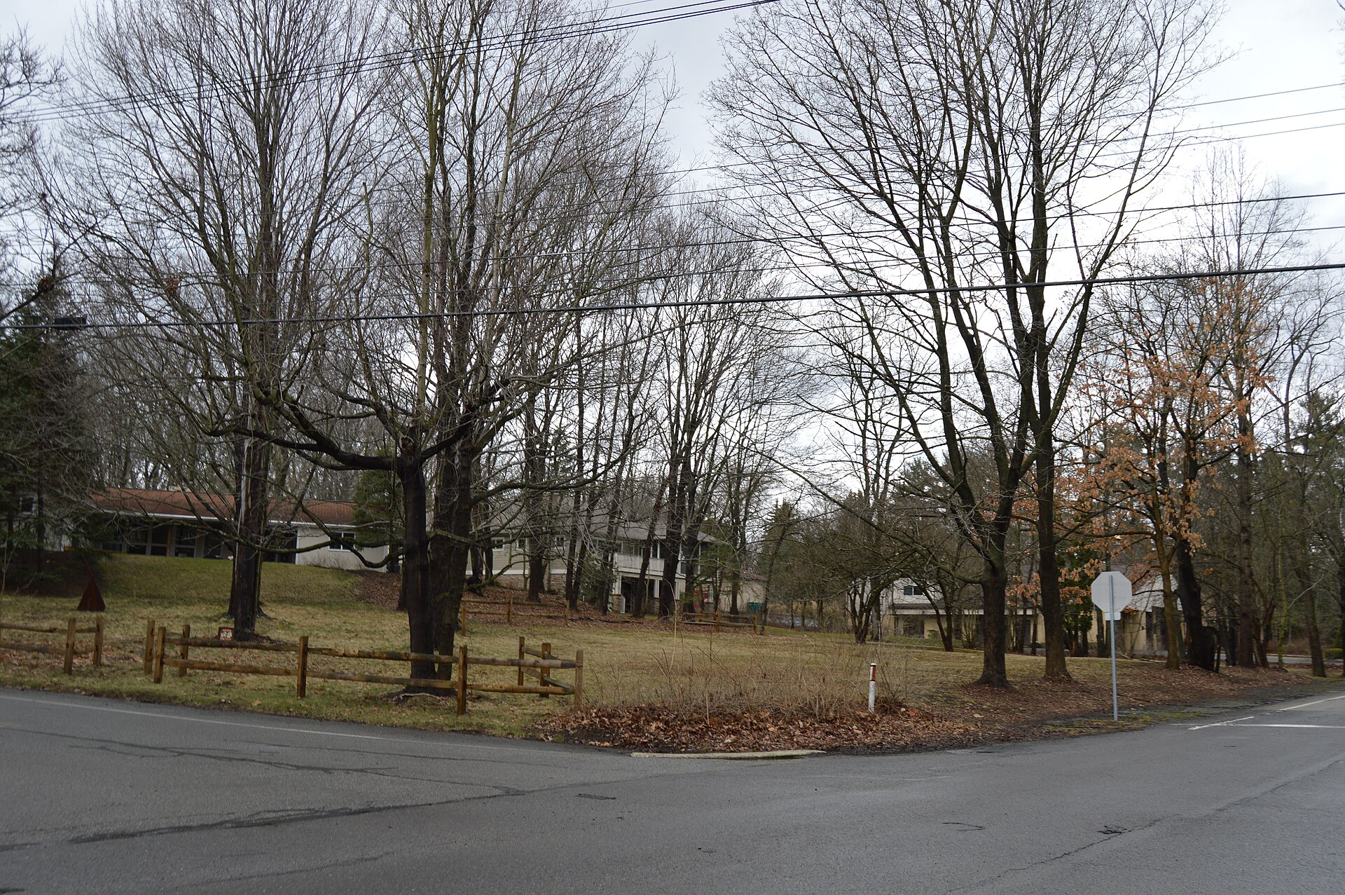 Typical wooded-residential scene in Bradford Woods, Pennsylvania, United States, seen looking northwest from the junction of Bradford and Wexford Run Roads.