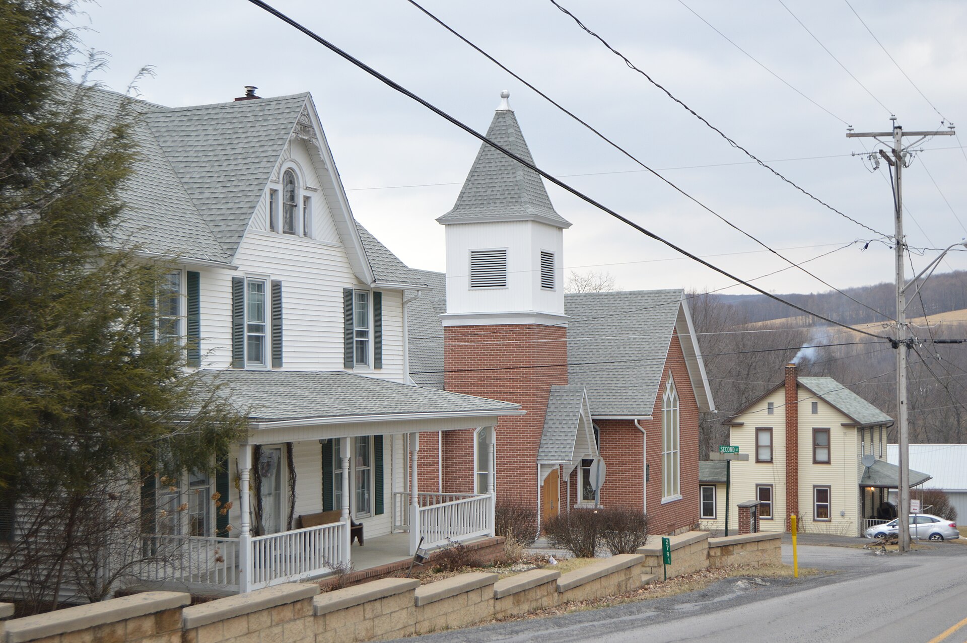 Houses and the Methodist church located on the northern side of Washington Street at the Second Street intersection in Dudley, Pennsylvania, United States.